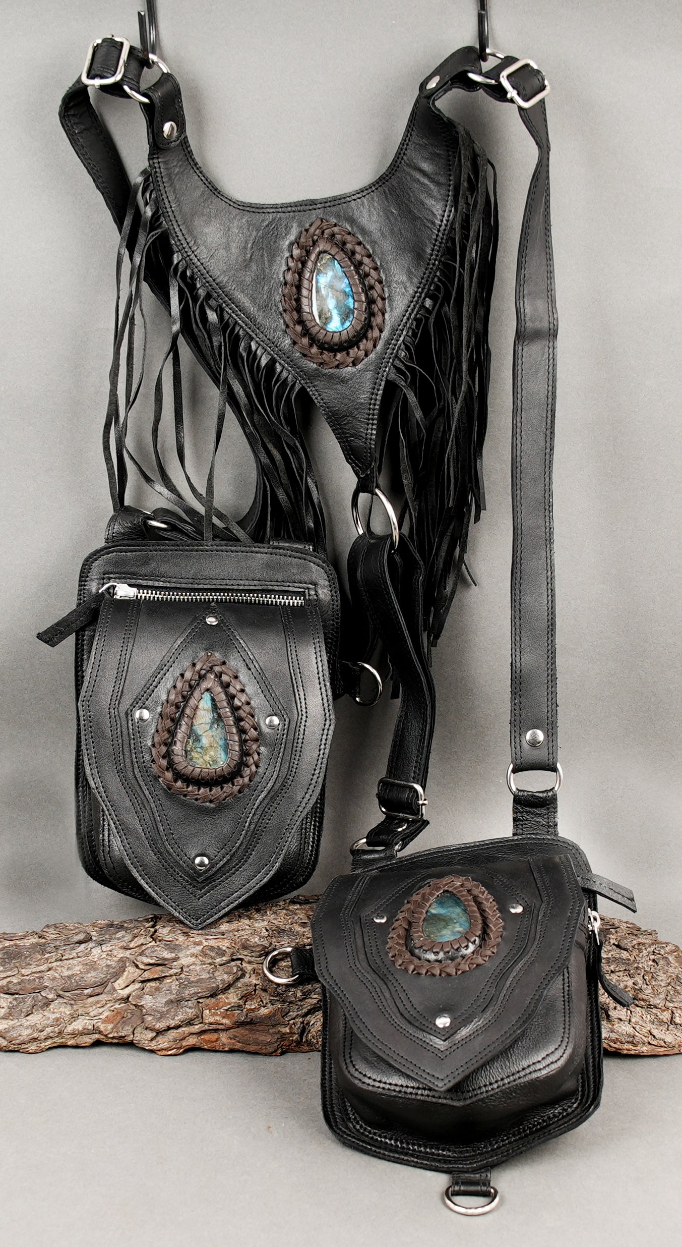 Tribal-inspired leather holster with gemstone inlay and fringe trim