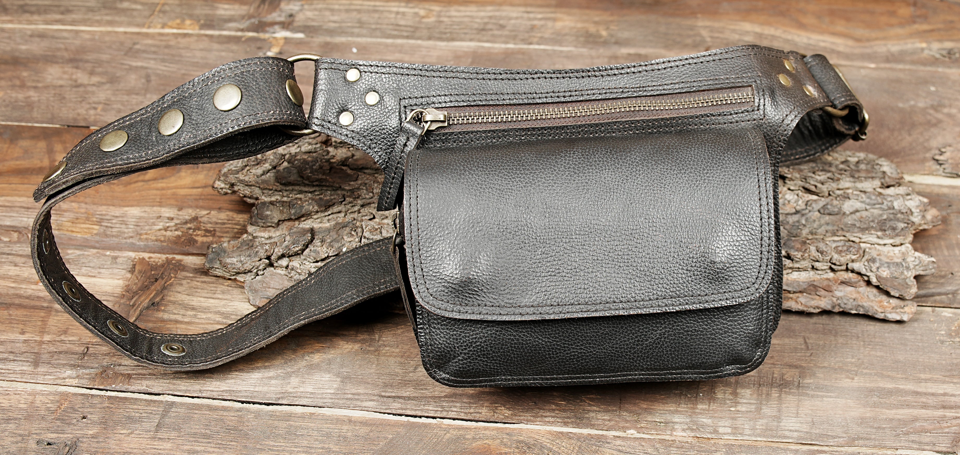 Black leather hip bag with multiple compartments