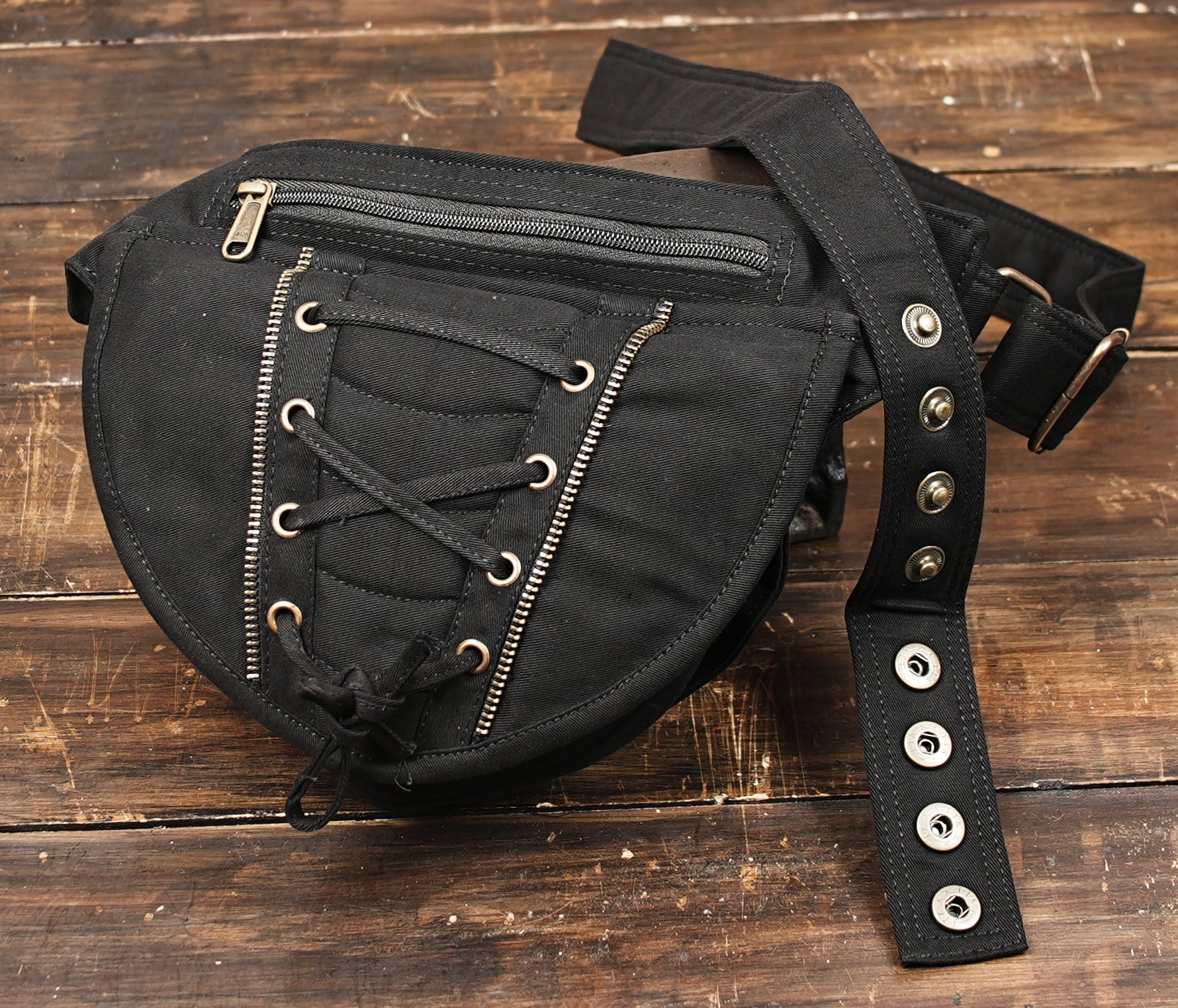 Black lace-up fanny pack styled on mannequin
