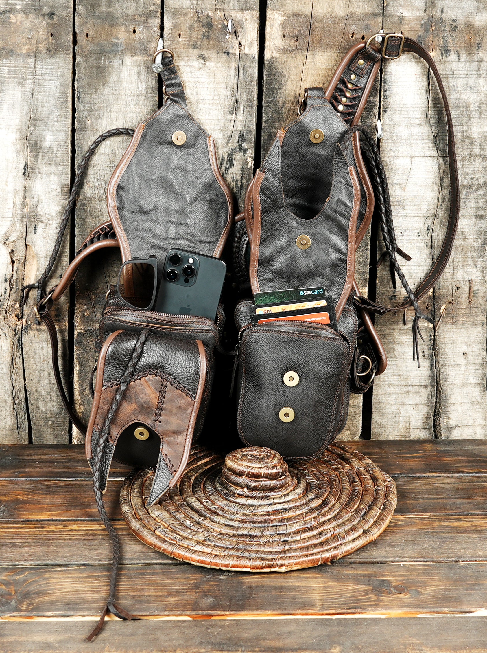 “Handmade brown leather holster with carved tribal designs and tassel details”