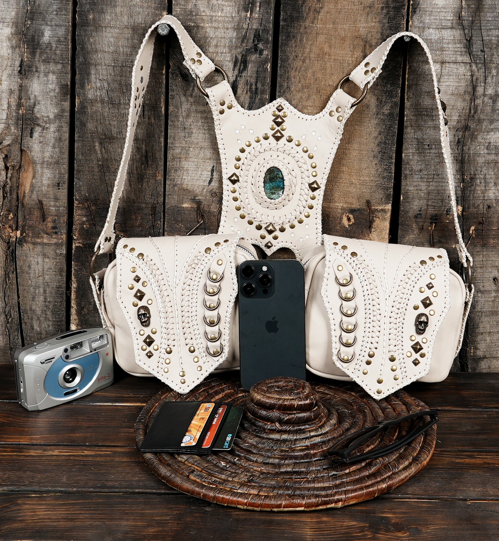 Model wearing white leather shoulder holster bag