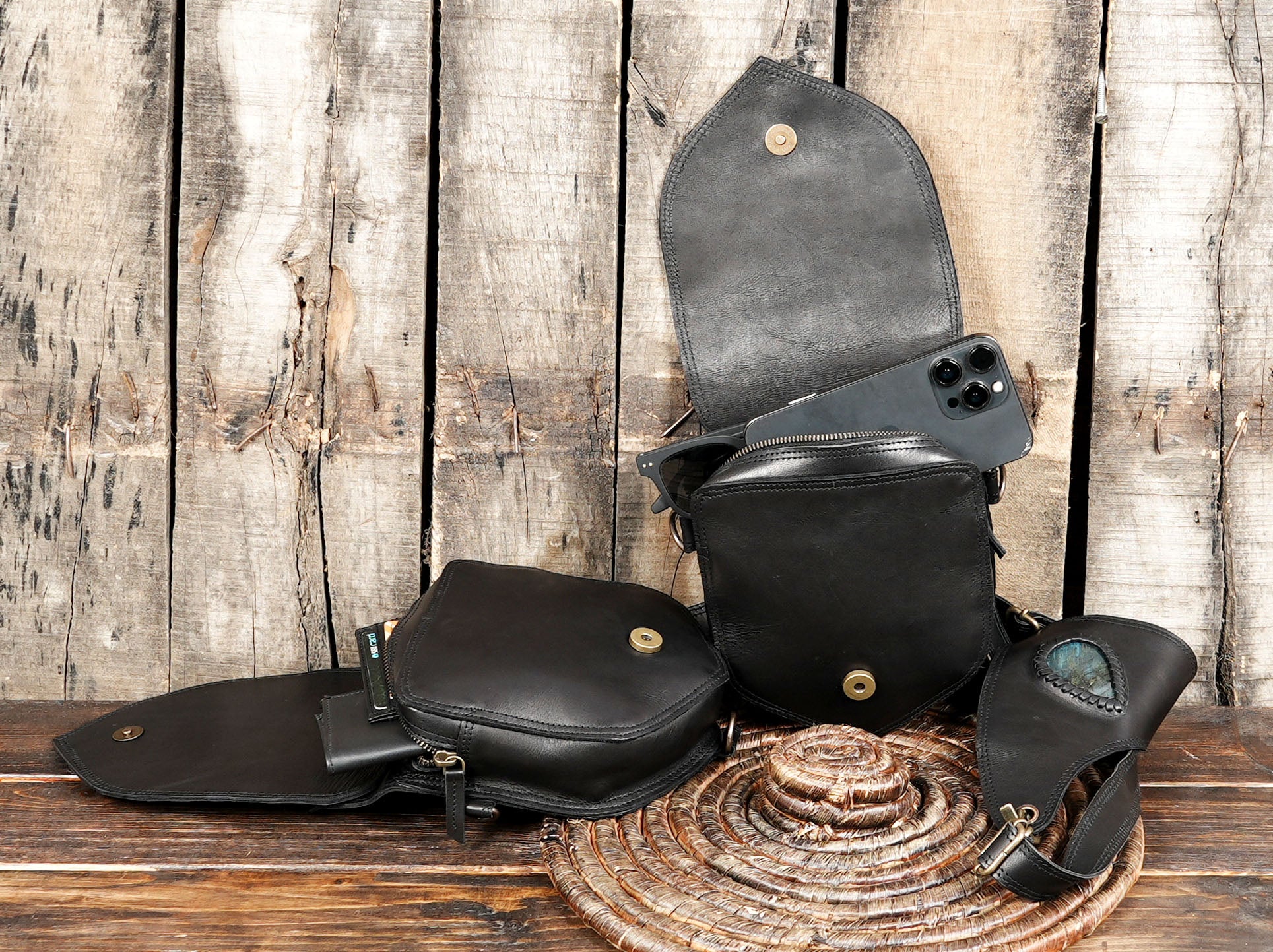 Sleek black leather shoulder holster with practical storage