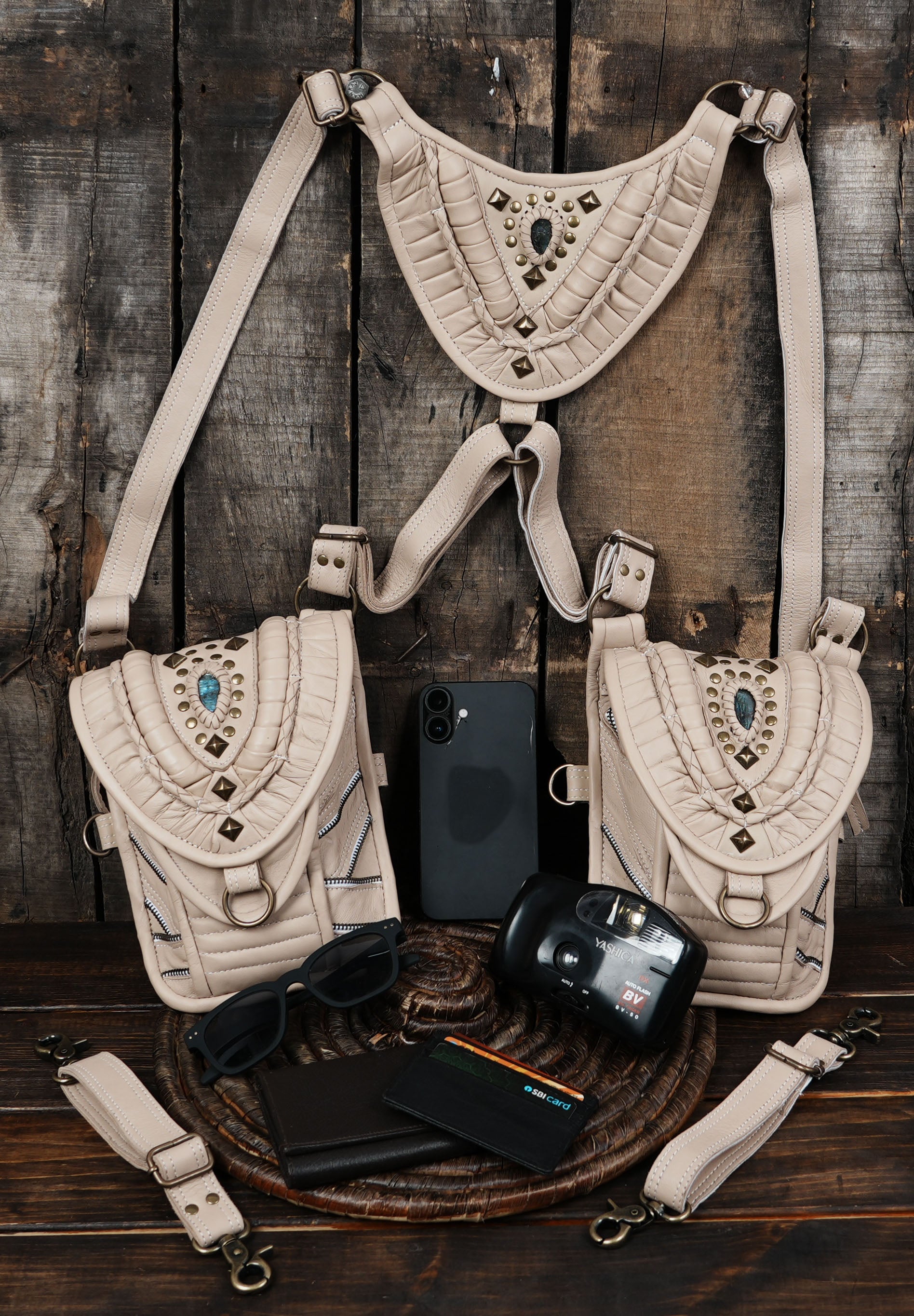 “Handmade cream leather utility holster with gemstone and brass hardware”