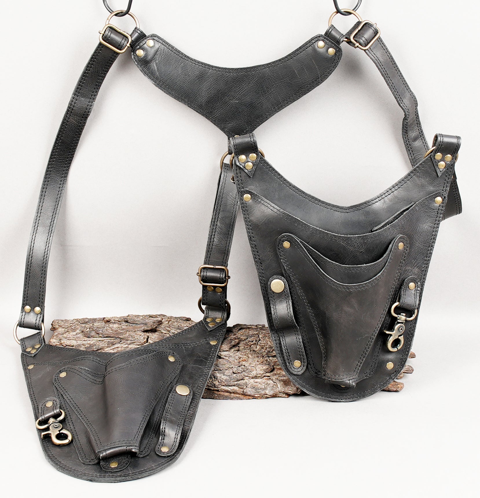 Black leather utility holster with multiple adjustment points