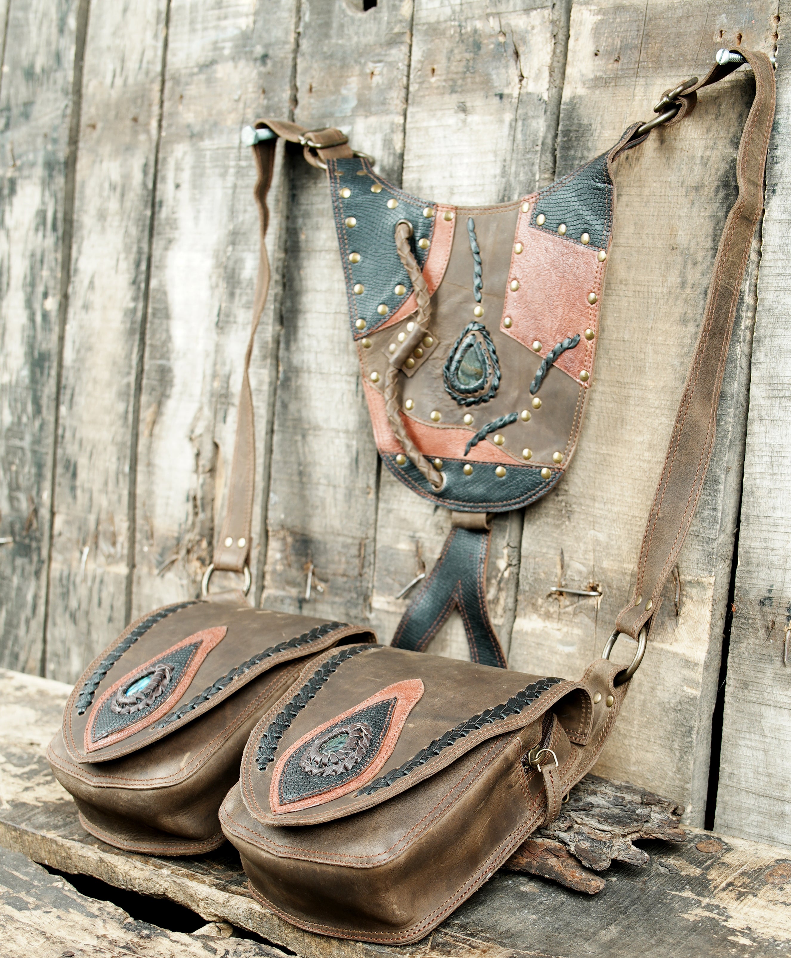 “Brown leather double pouch holster with black and tan patchwork design”