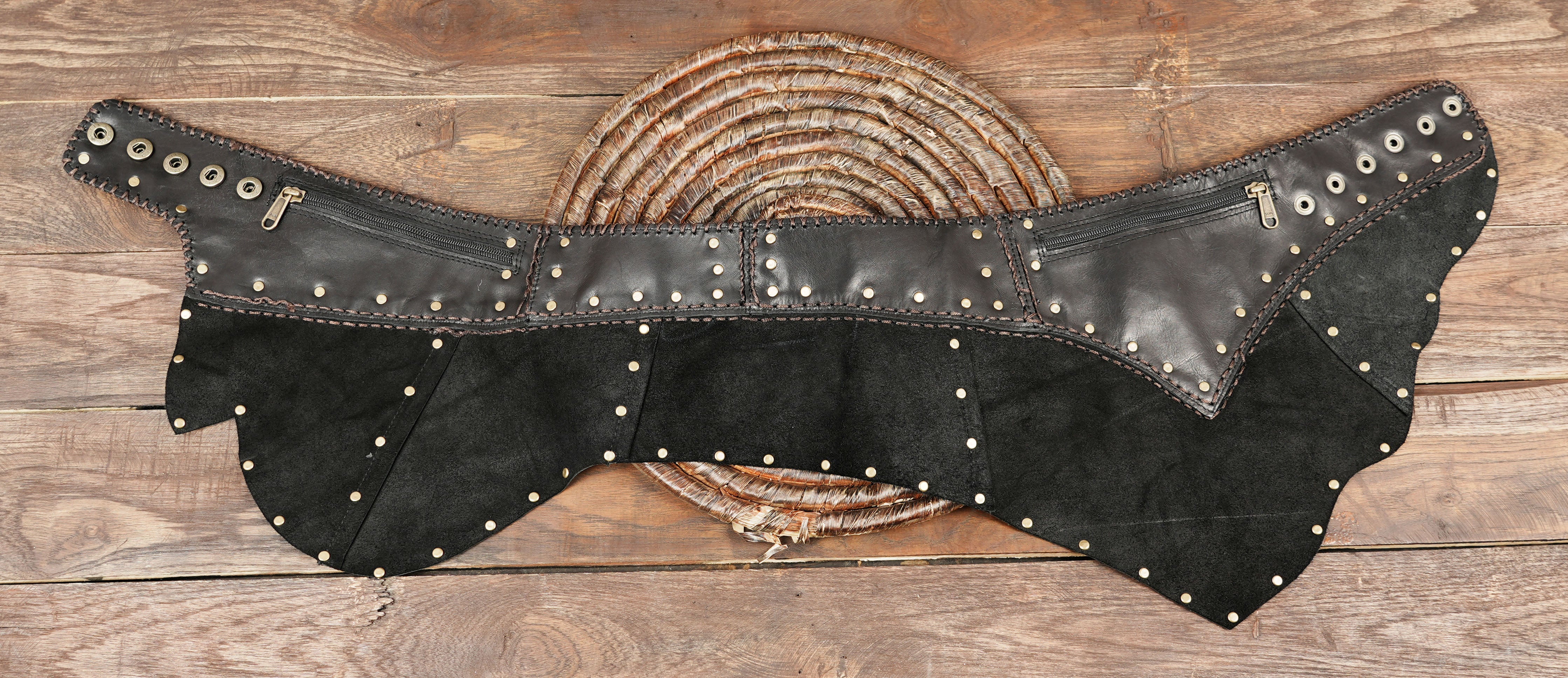 “Handcrafted leather skirt with metal studs, steampunk Burning Man festival wear.