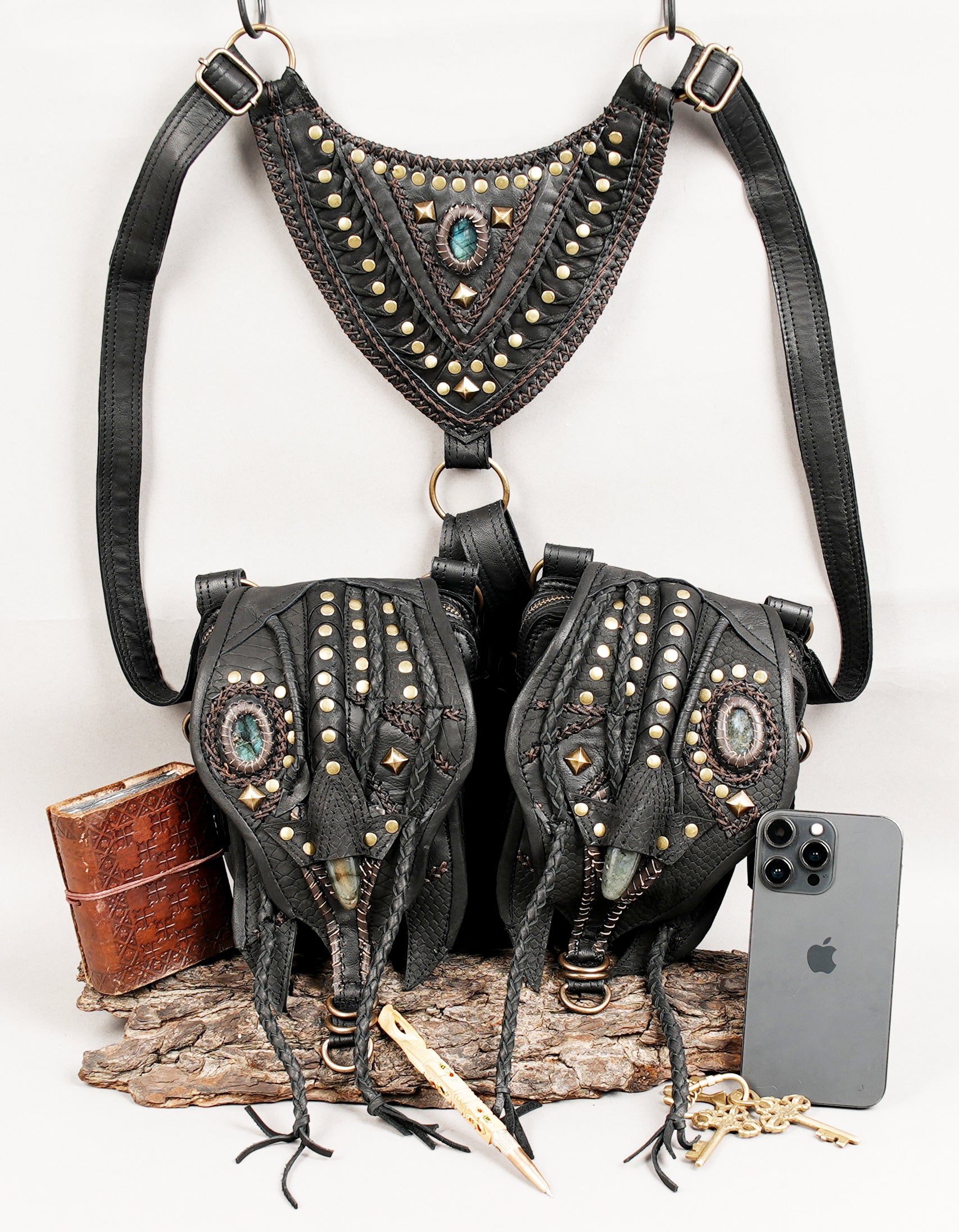 Gothic leather holster bag with detailed stitching and metal studs