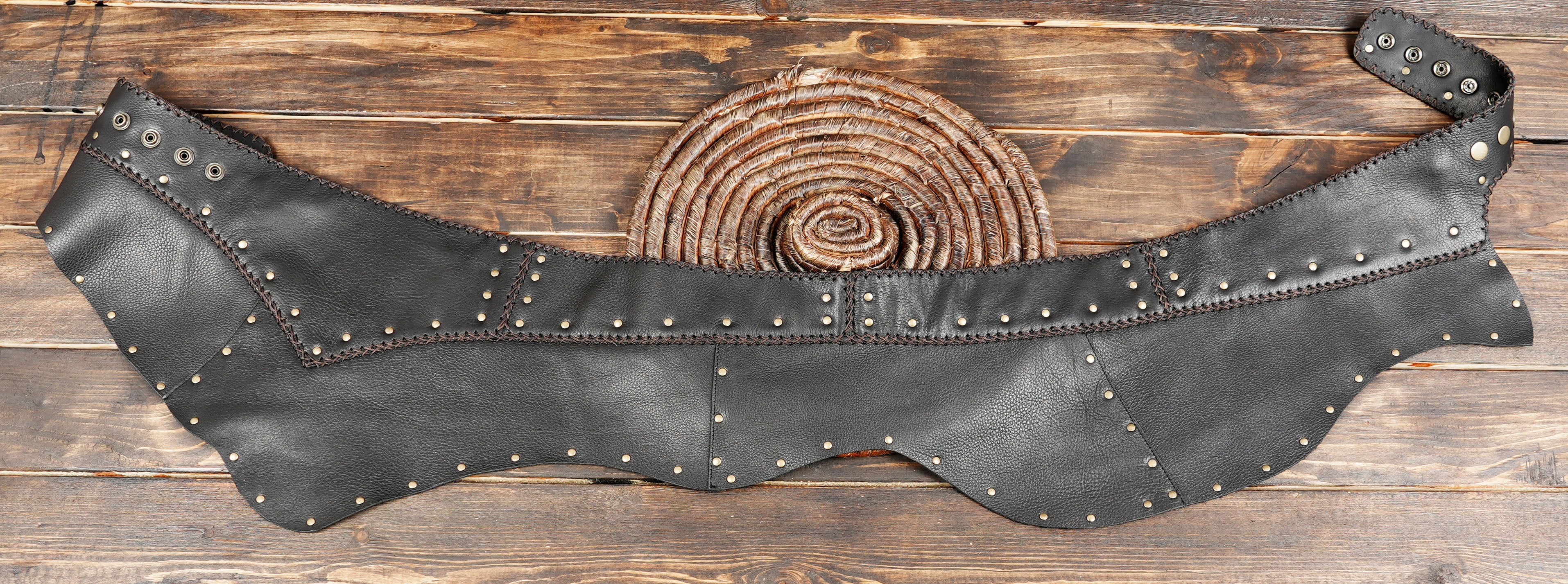 Black leather skirt with studded trim and handmade rustic look