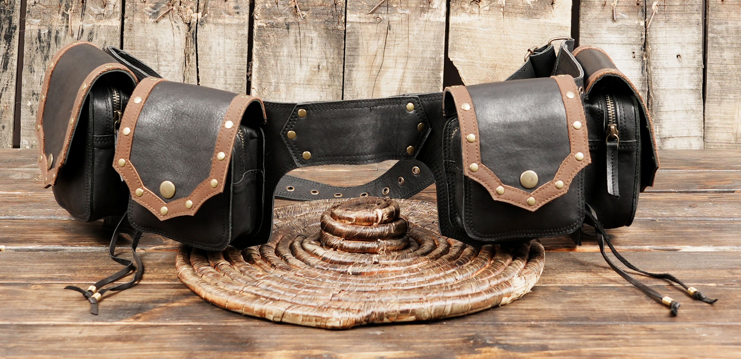 steampunk-inspired look. Its adjustable strap ensures a comfortable fit for different waist sizes, while the secure pouch closures keep your belongings safe.