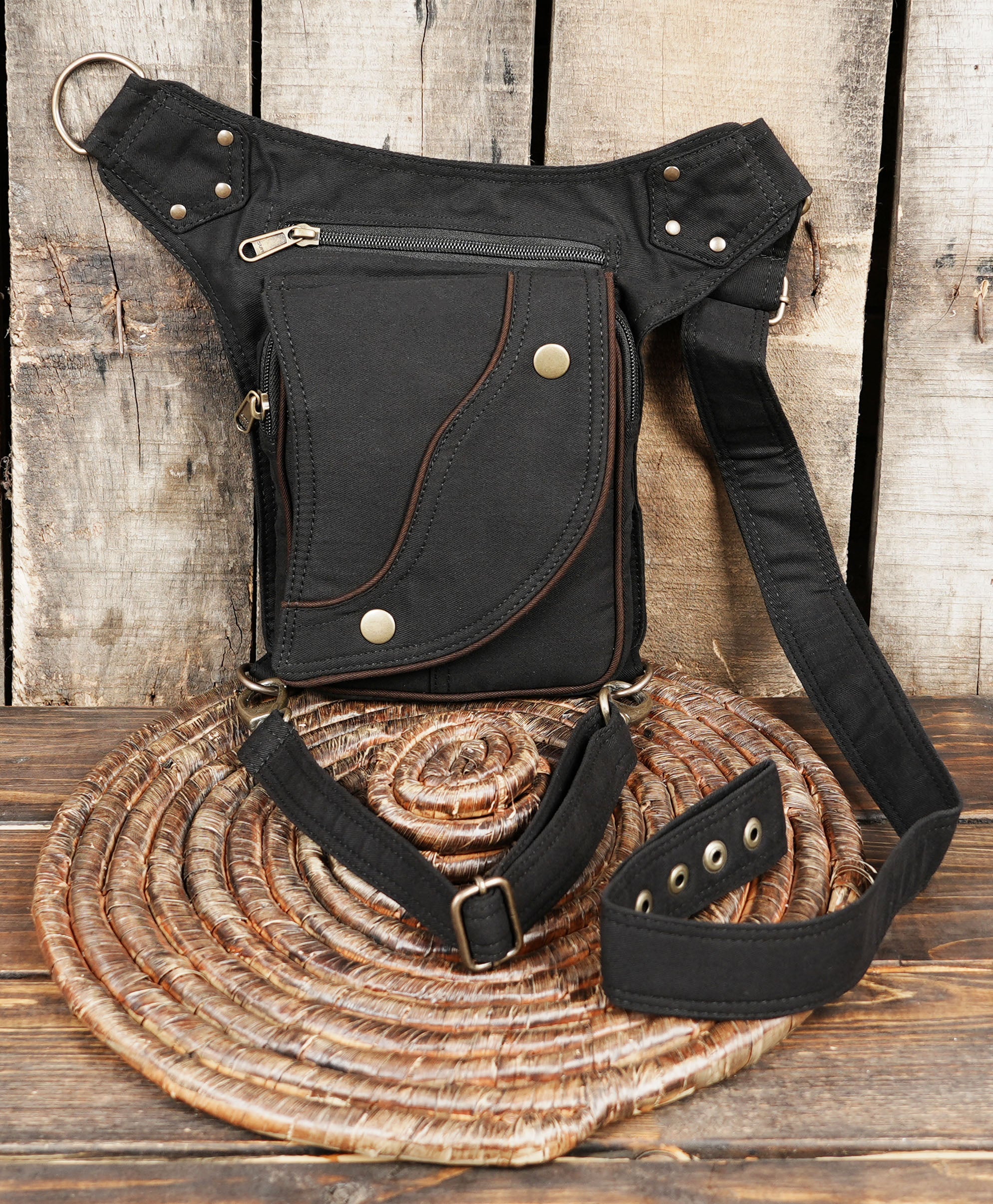Tribal style canvas side thigh pack with curved front flap pocket and brass hardware.