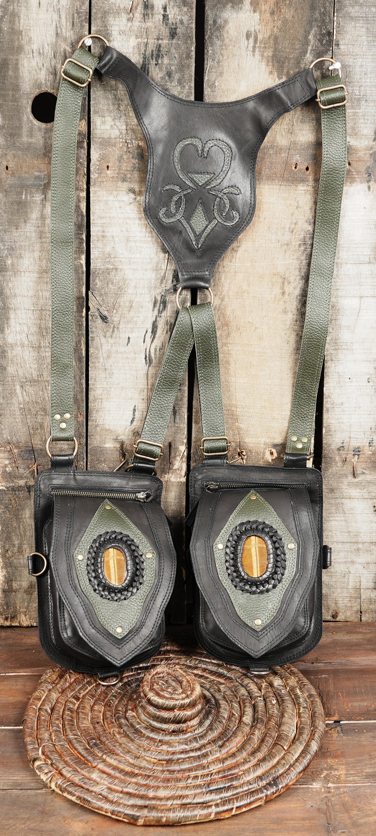 Black leather utility holster with green accents and braided trim