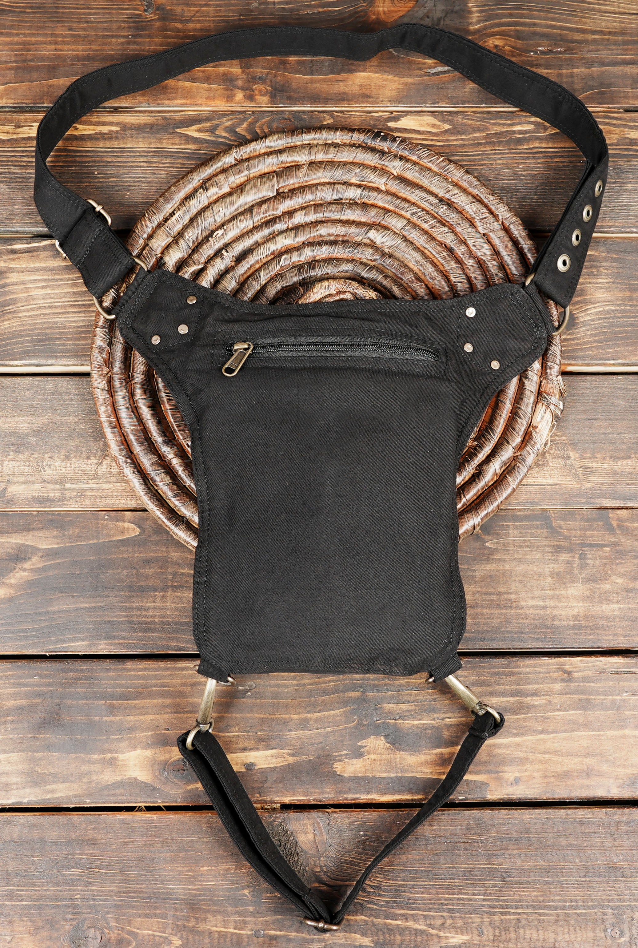 Biker style cotton thigh bag with swivel snap hooks and top zippered compartments.