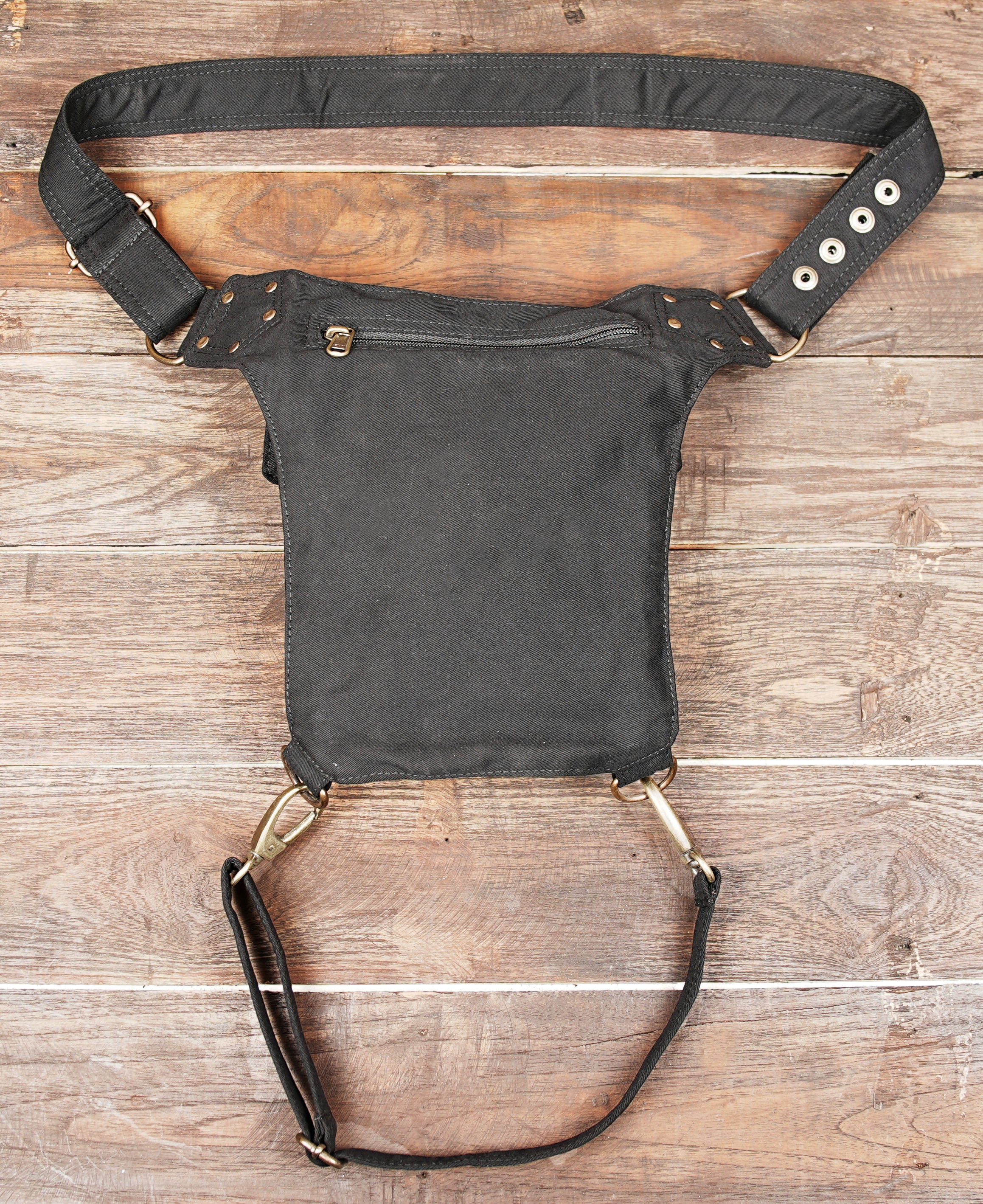 Biker style cotton thigh bag with swivel snap hooks and zippered compartments.