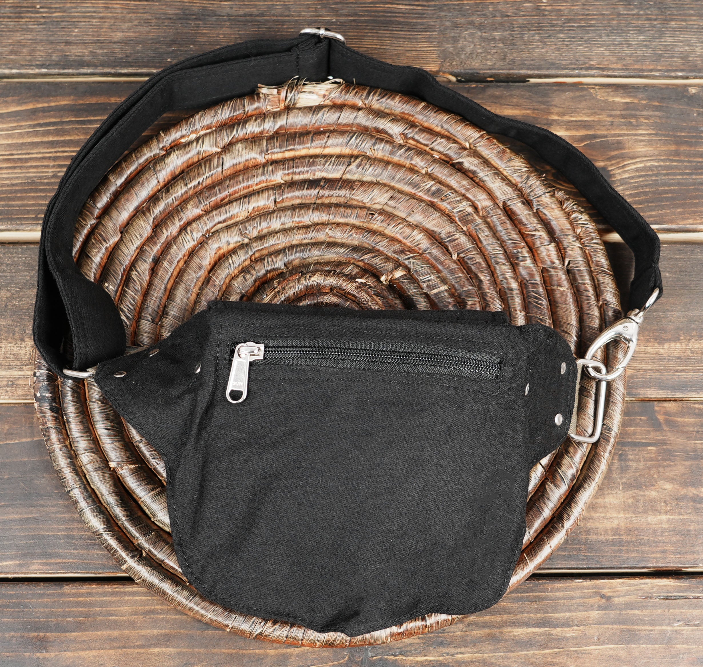 Minimalist black cotton waist bag, a secure and comfortable option for keeping essentials safe.