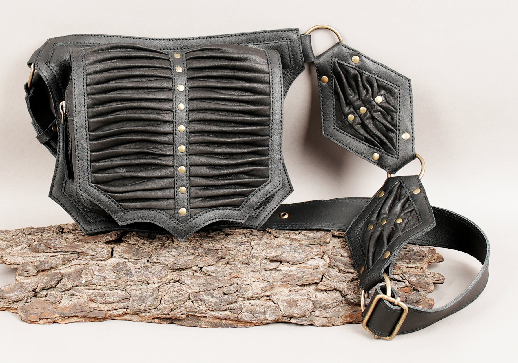 Black leather belt with pleated pouch and metal hardware