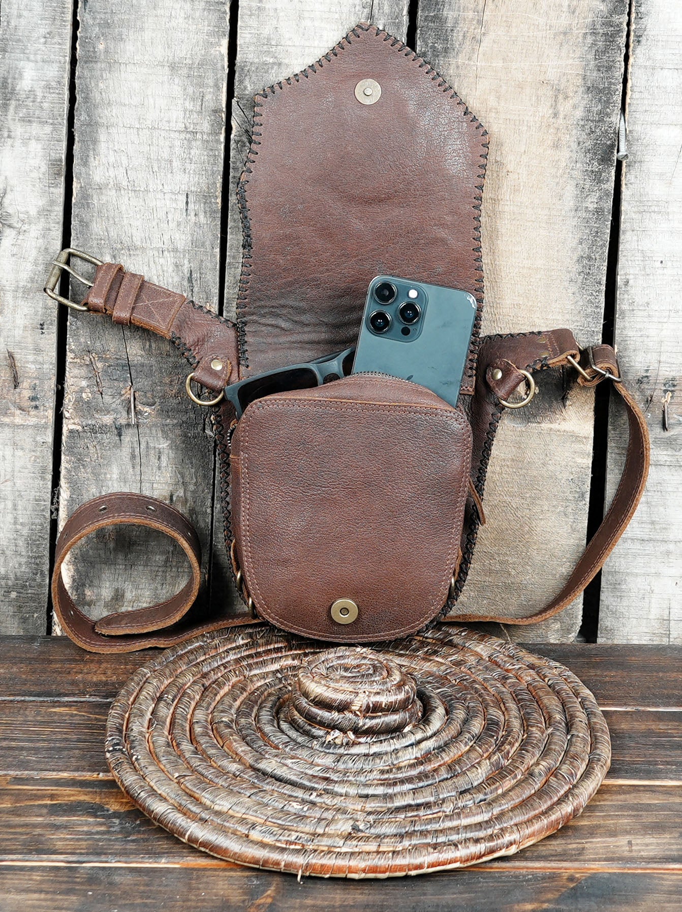 Adjustable leather waist belt with decorative rivets and stitching