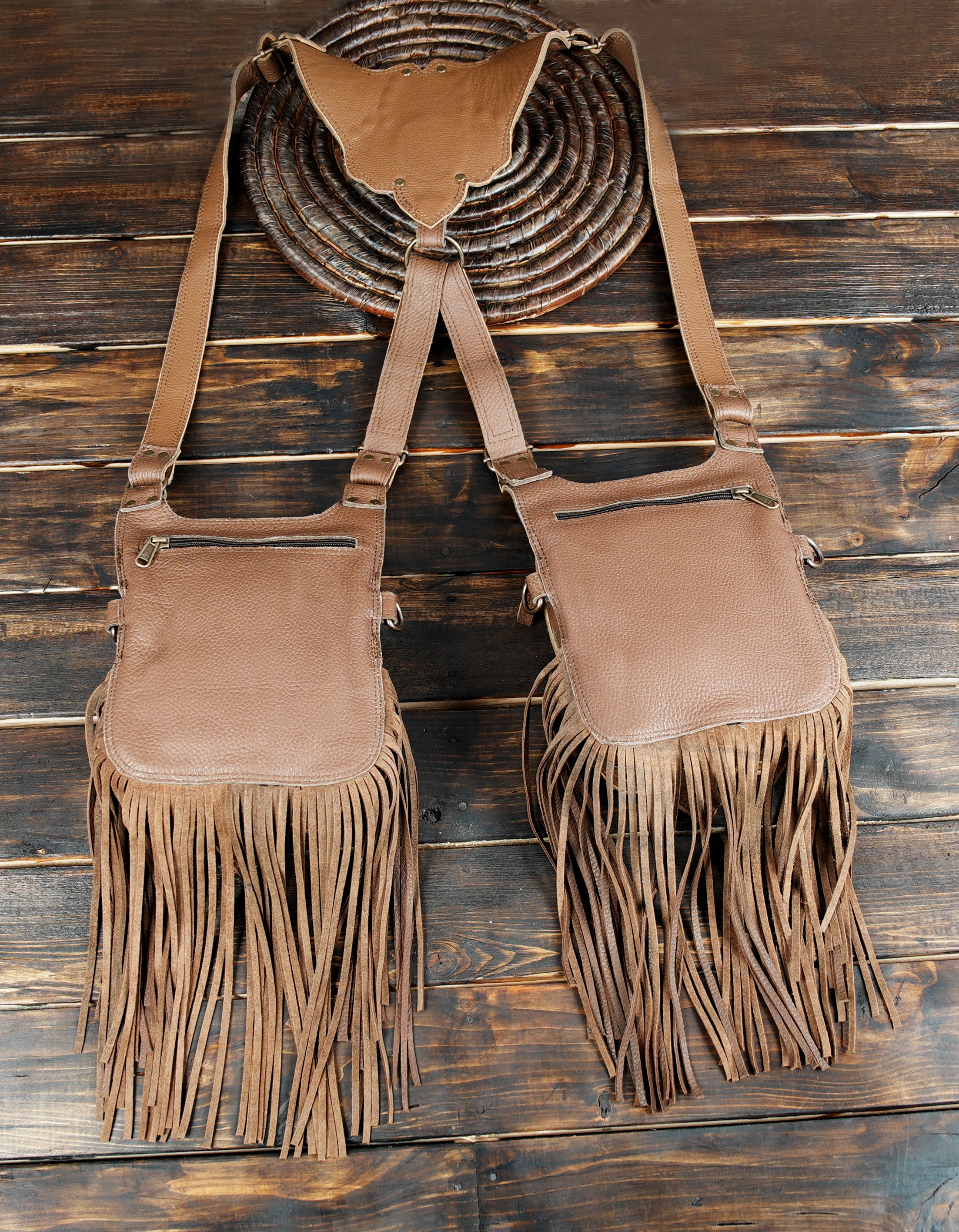 Rustic leather shoulder holster featuring gemstone and tassels