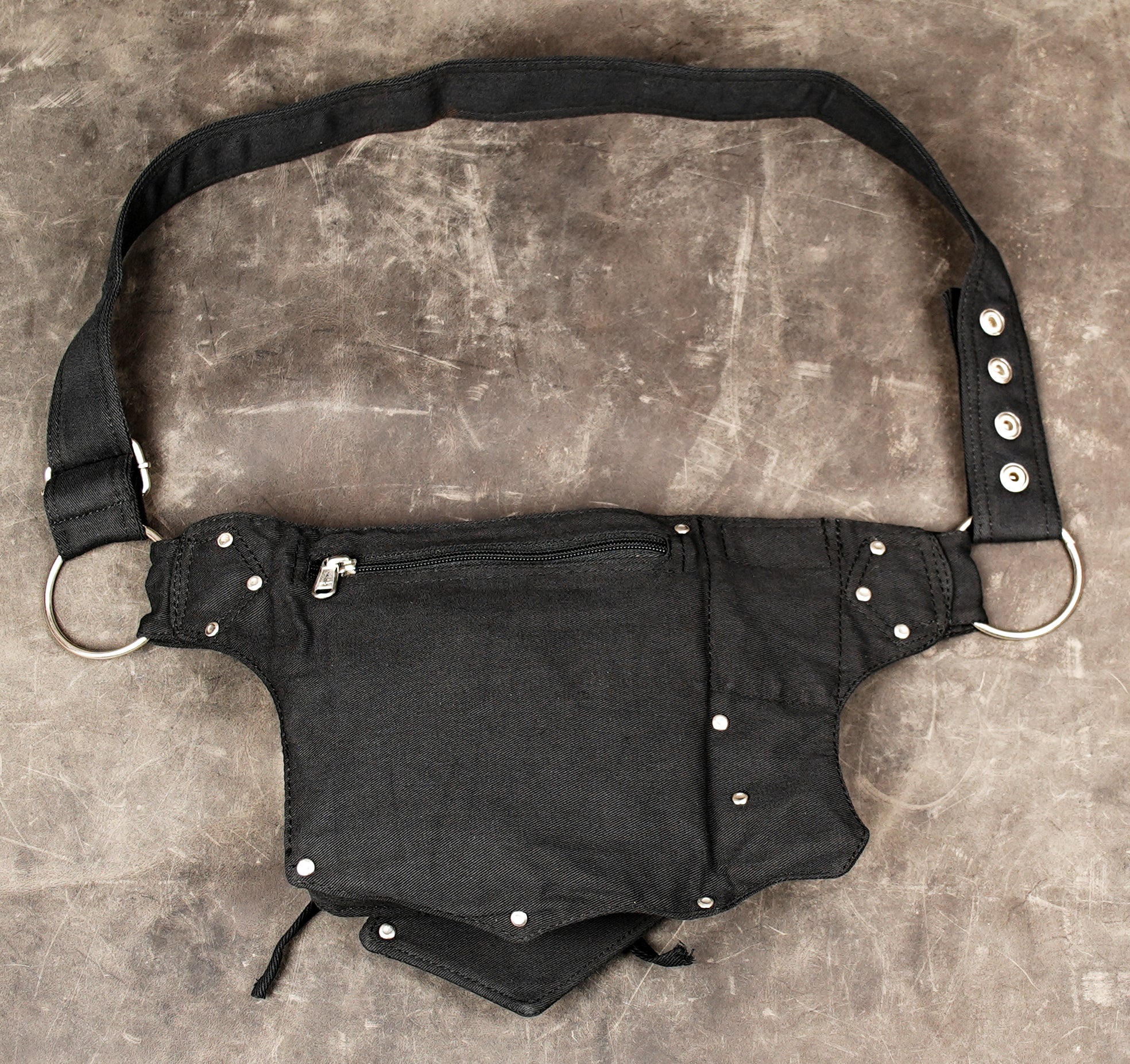 Secure travel waist bag with dual storage pouches and adjustable fit.