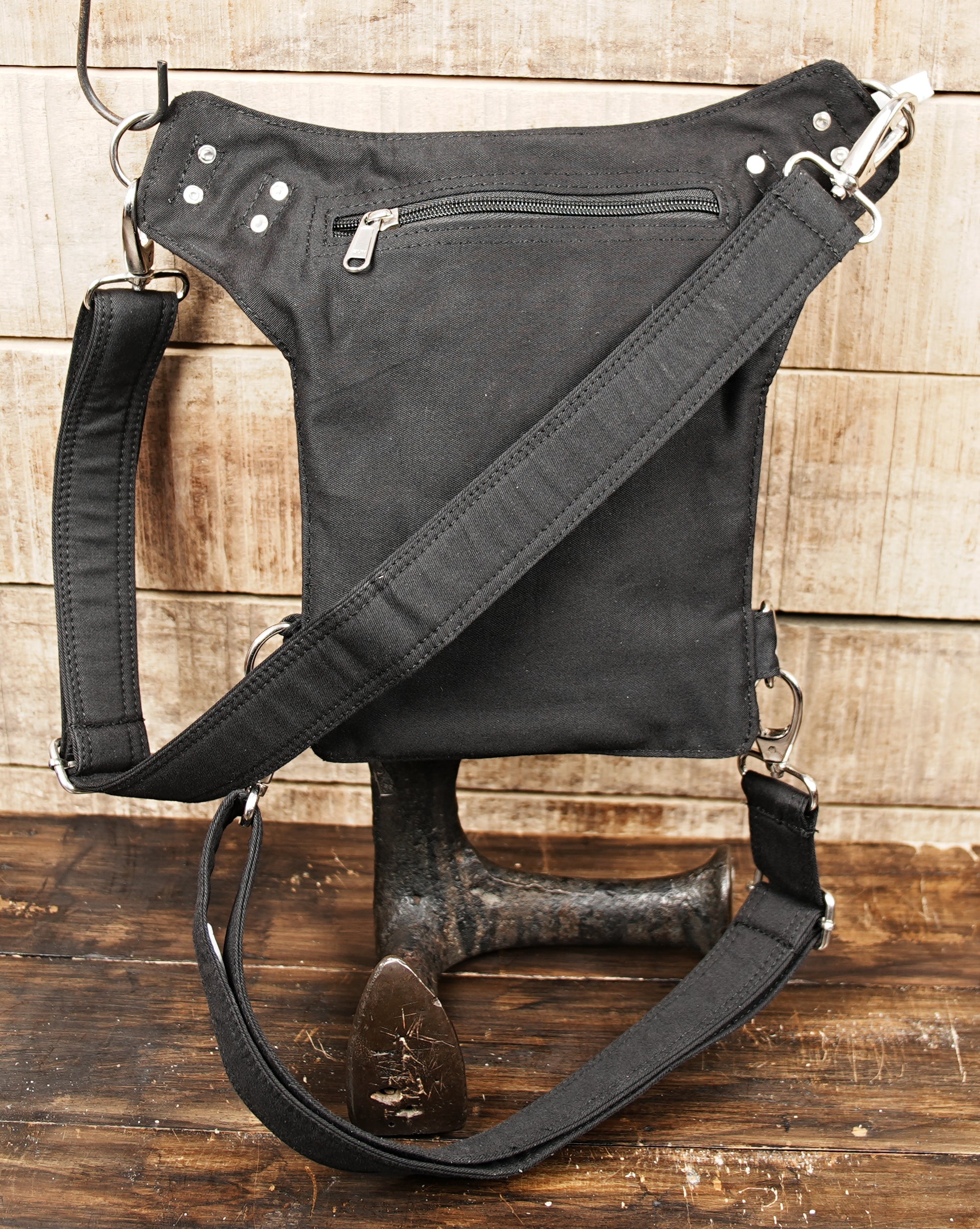 Festival utility pouch with thigh strap and black cotton storage bag
