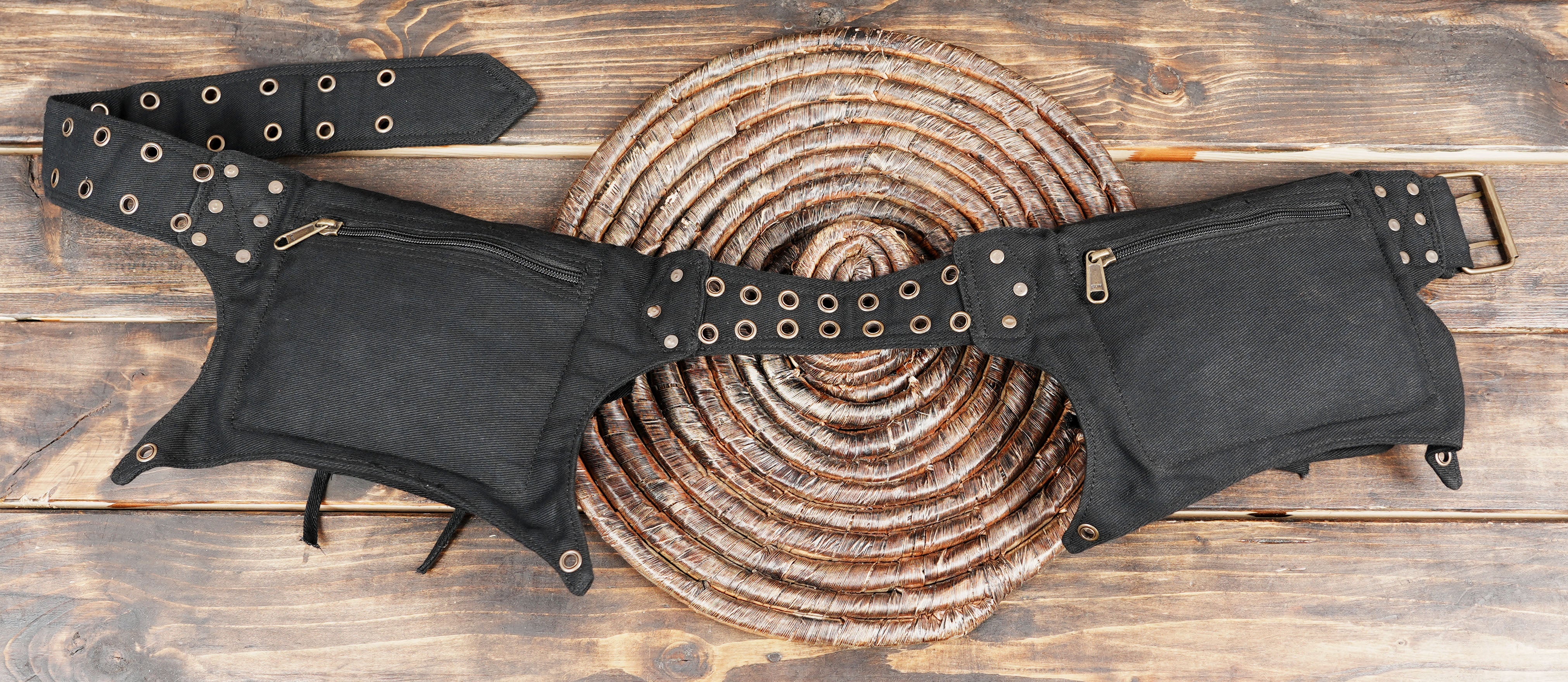 Multi-pocket black cotton waist belt with secure buckle closure.