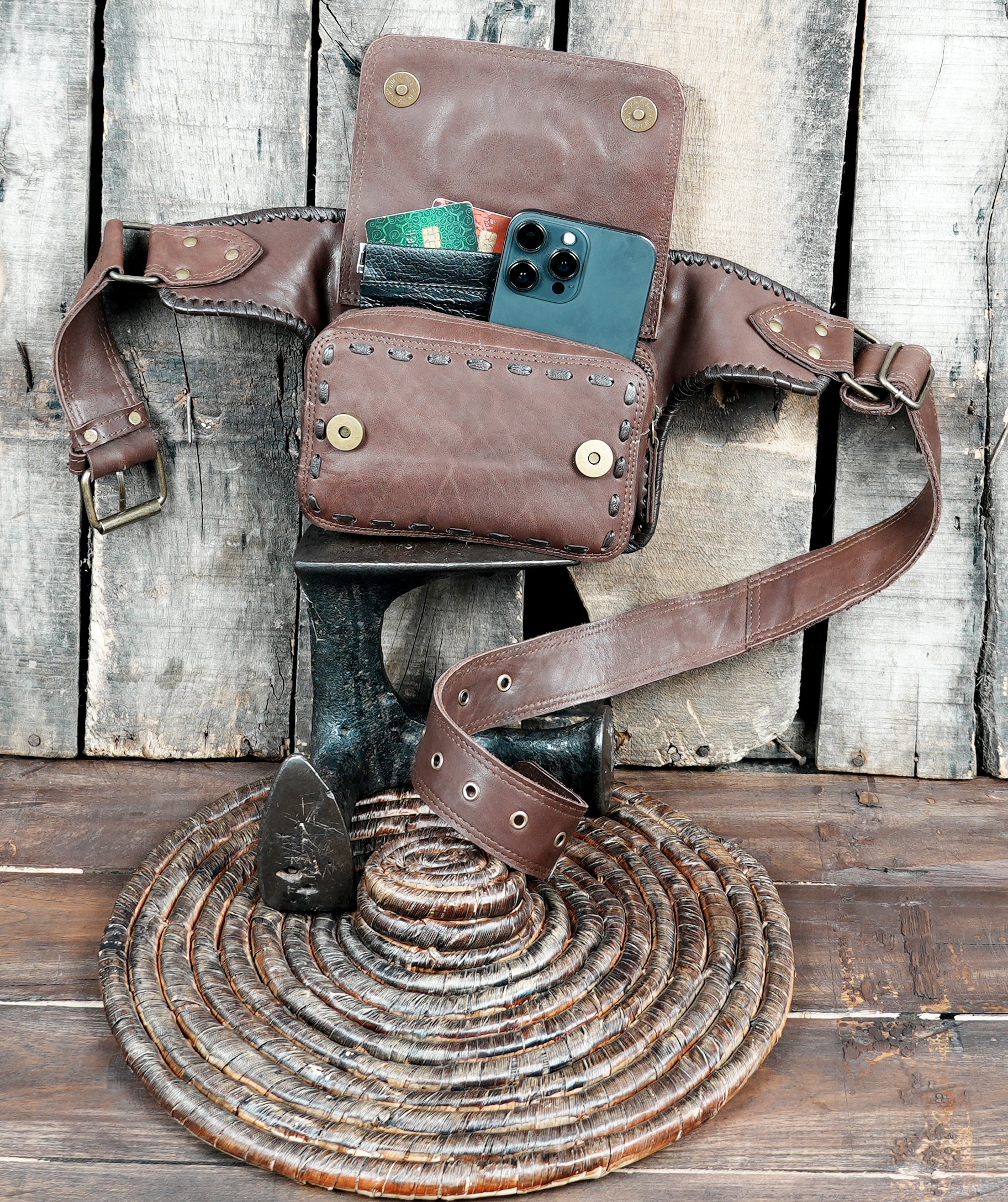 Close-up of stone accent on brown leather waist pouch