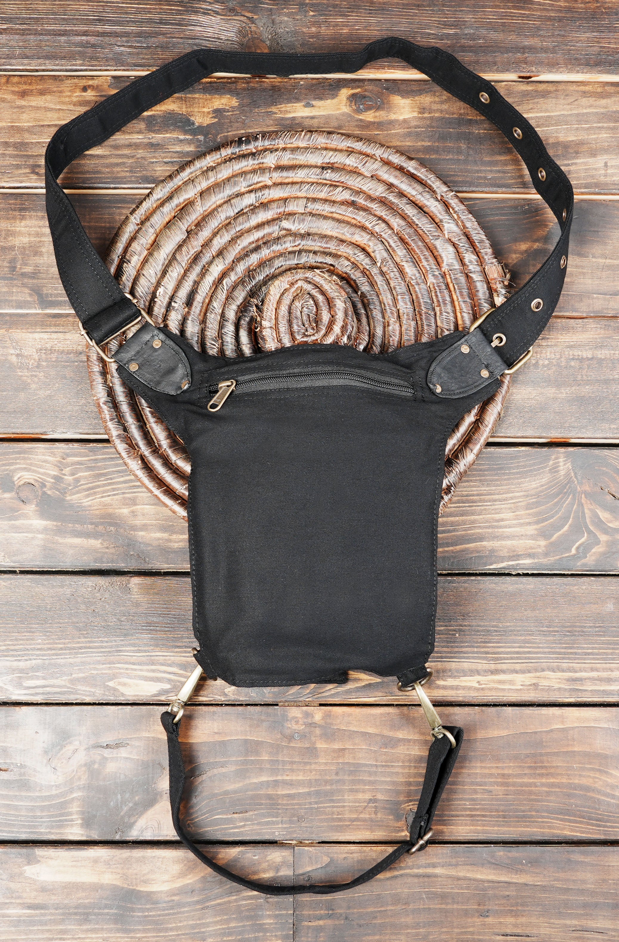 Biker style cotton thigh bag with swivel snap hooks and zippered compartments.