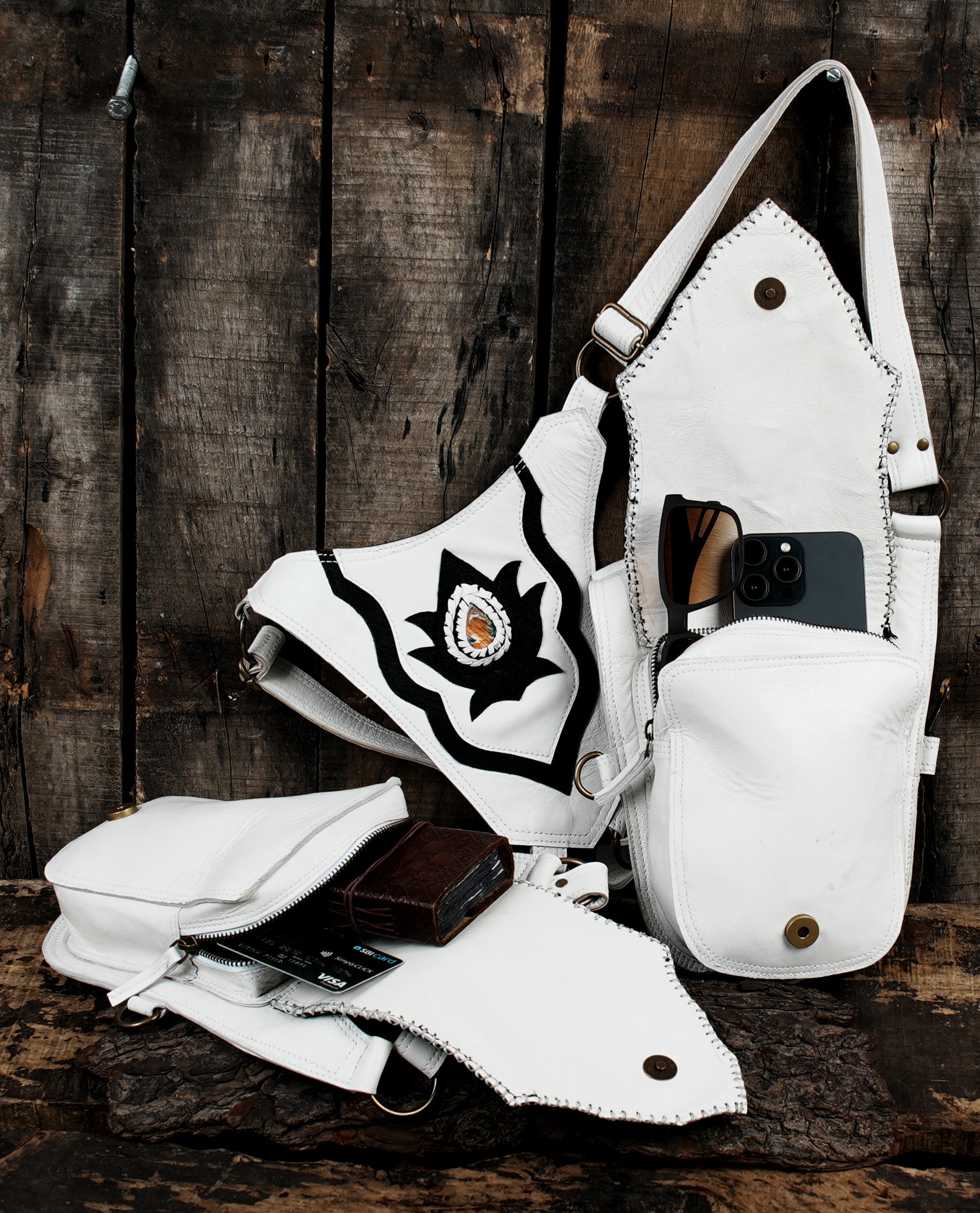 “Cosplay-ready white holster with black tribal artwork and adjustable straps”