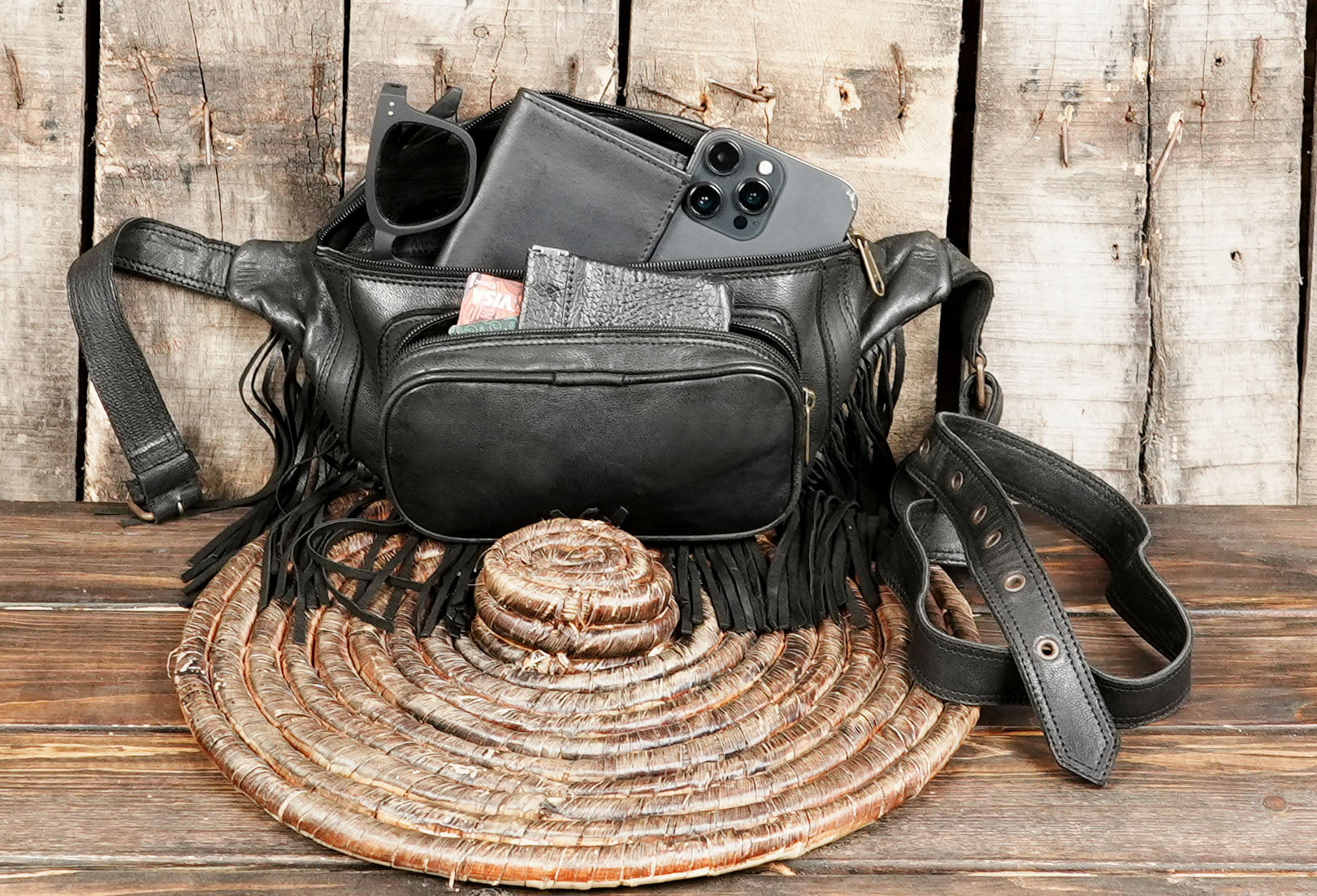 Artisan crafted leather waist pack with fringe detailing
