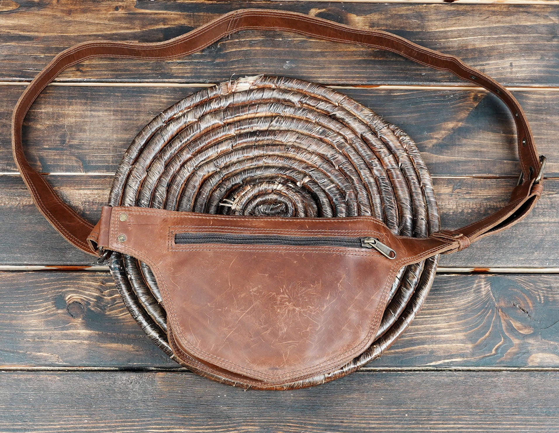Rustic leather waist belt with metal ring embellishments