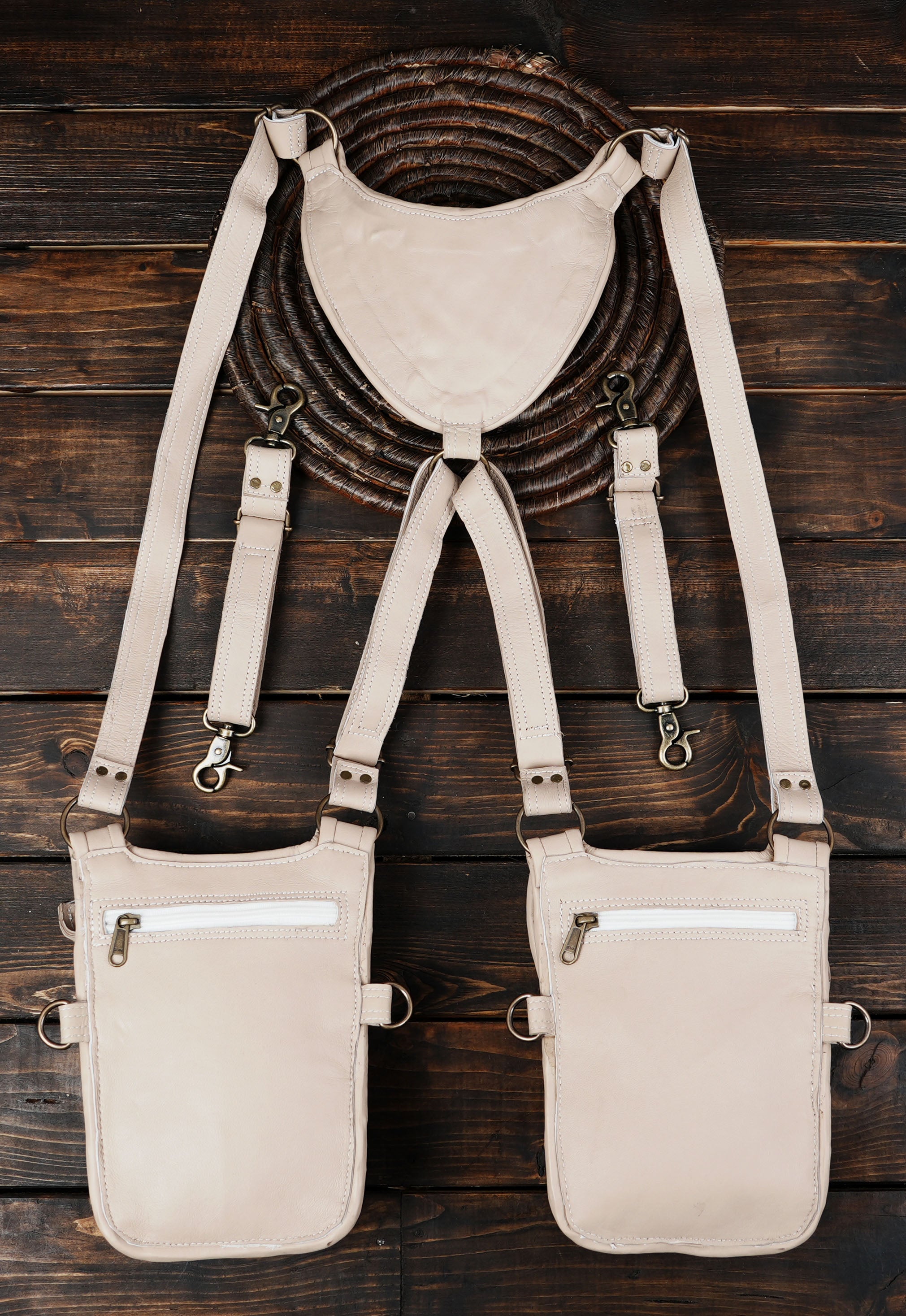 “Boho tribal ivory leather holster with layered flap design and stone accent”