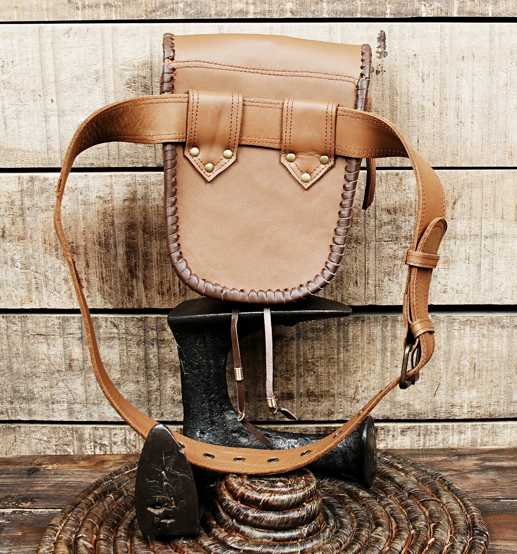 Artisan leather waist belt bag with decorative stone centerpiece