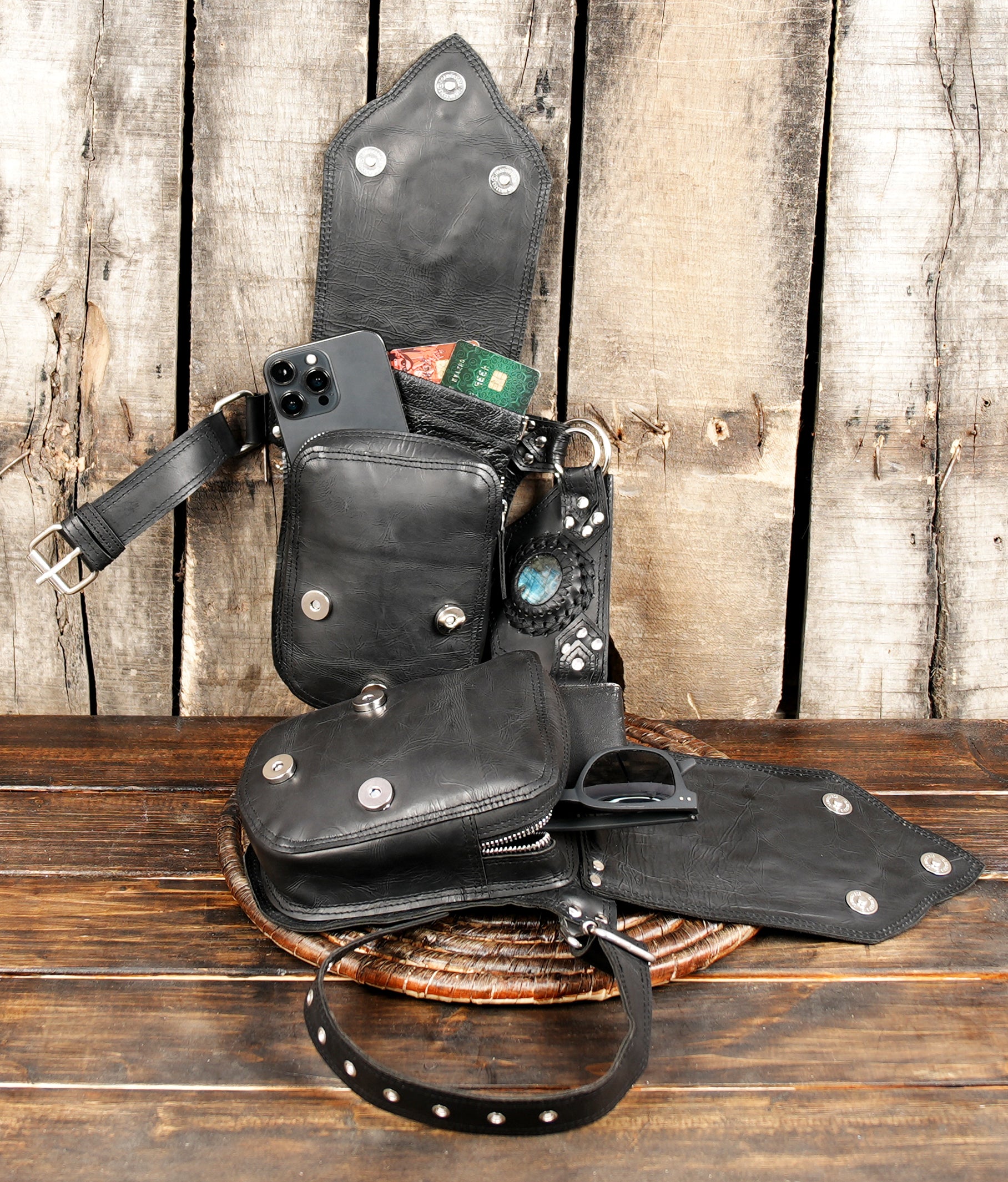 Black leather waist belt with artisan stone pouch design