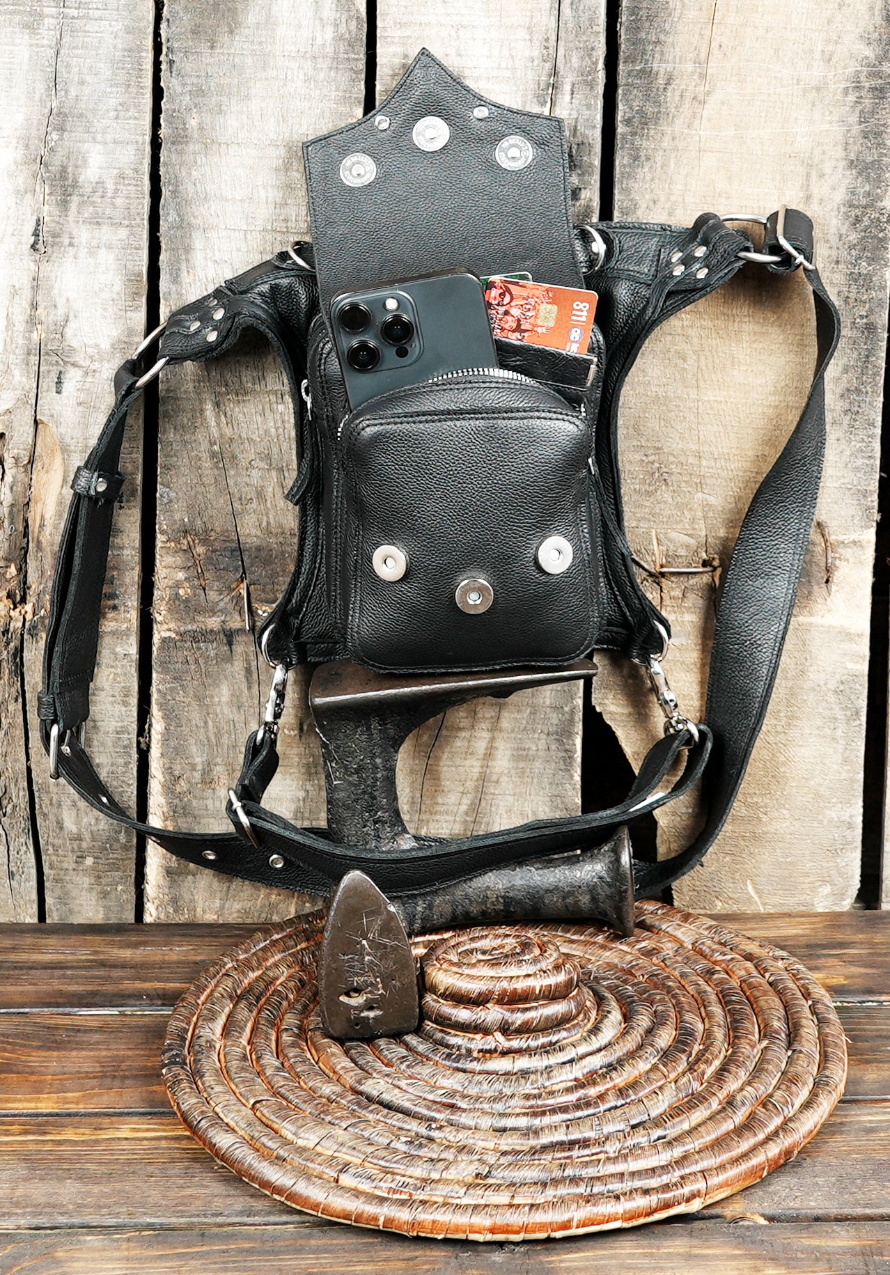 Alternative fashion leather thigh holster bag on rustic background