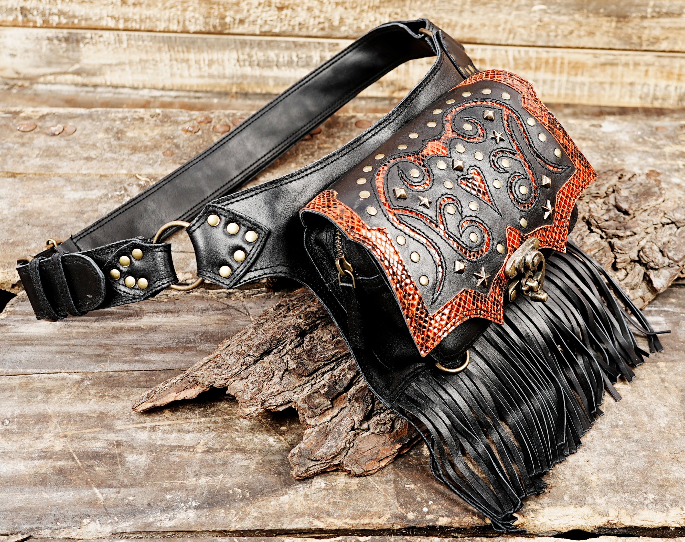 Festival leather waist belt with decorative studs, red leather accents, and fringe