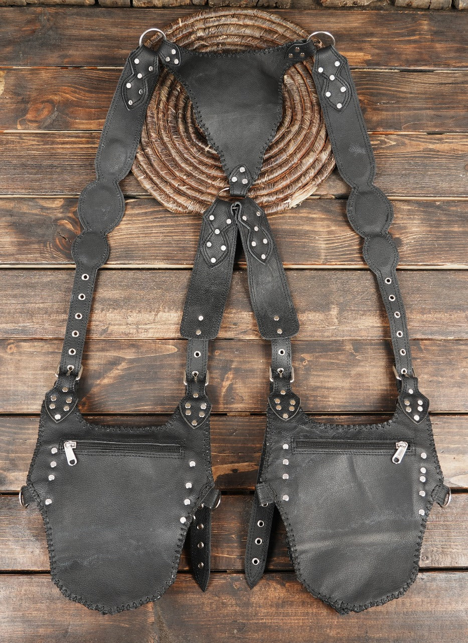Artisanal black leather holster with removable storage pouches and metal rings