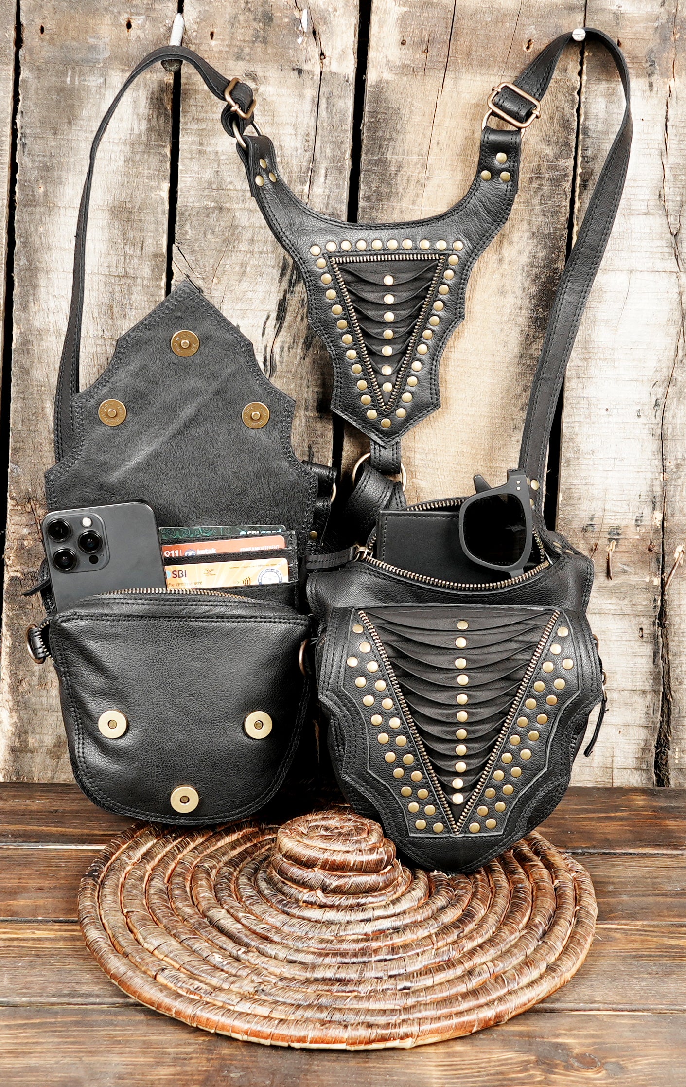 “Layered panel black leather holster with brass rivets and sturdy hardware”