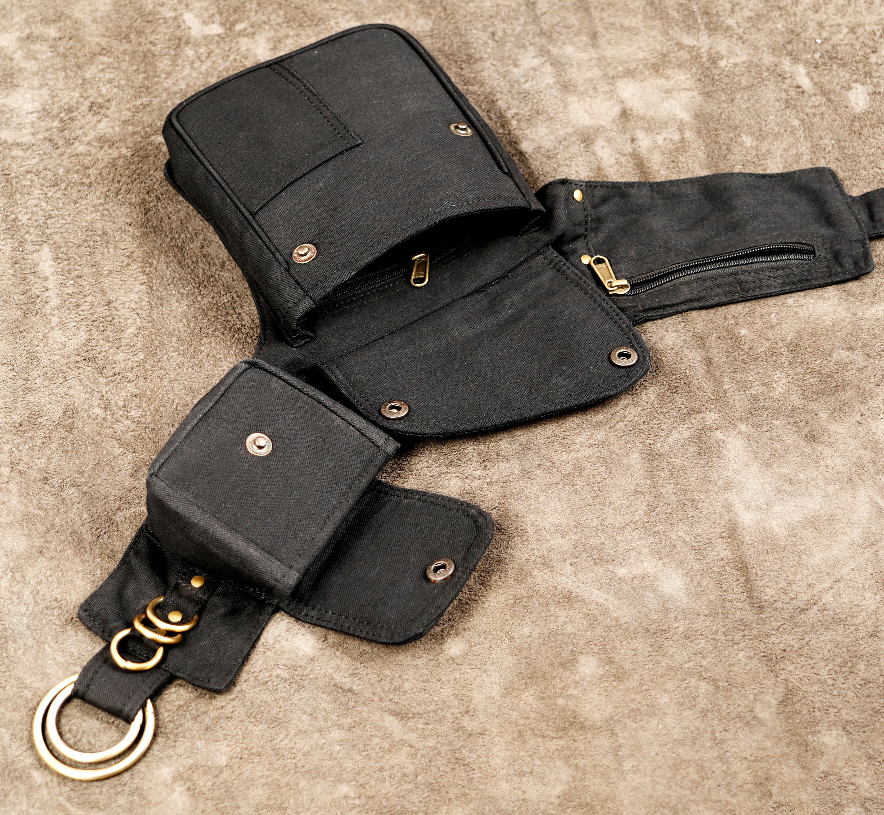 Rave and festival hip pack featuring multi-pocket black canvas