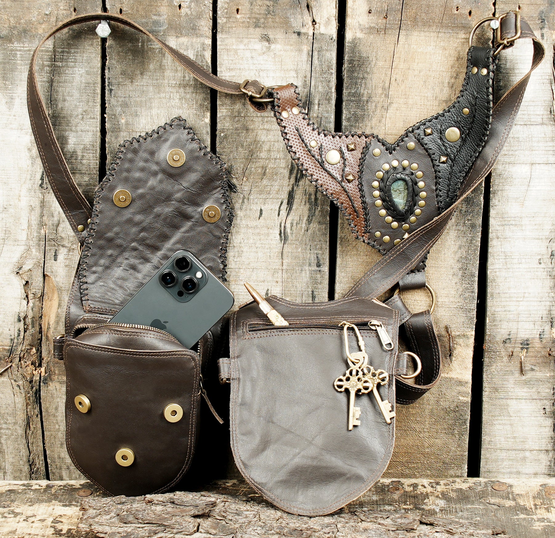 Rustic brown leather chest holster with gothic stud detailing