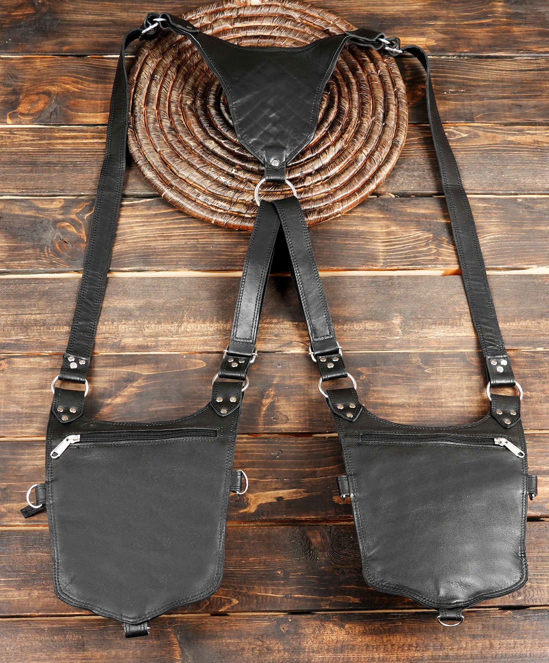 Dual pocket leather holster with spiked flap design