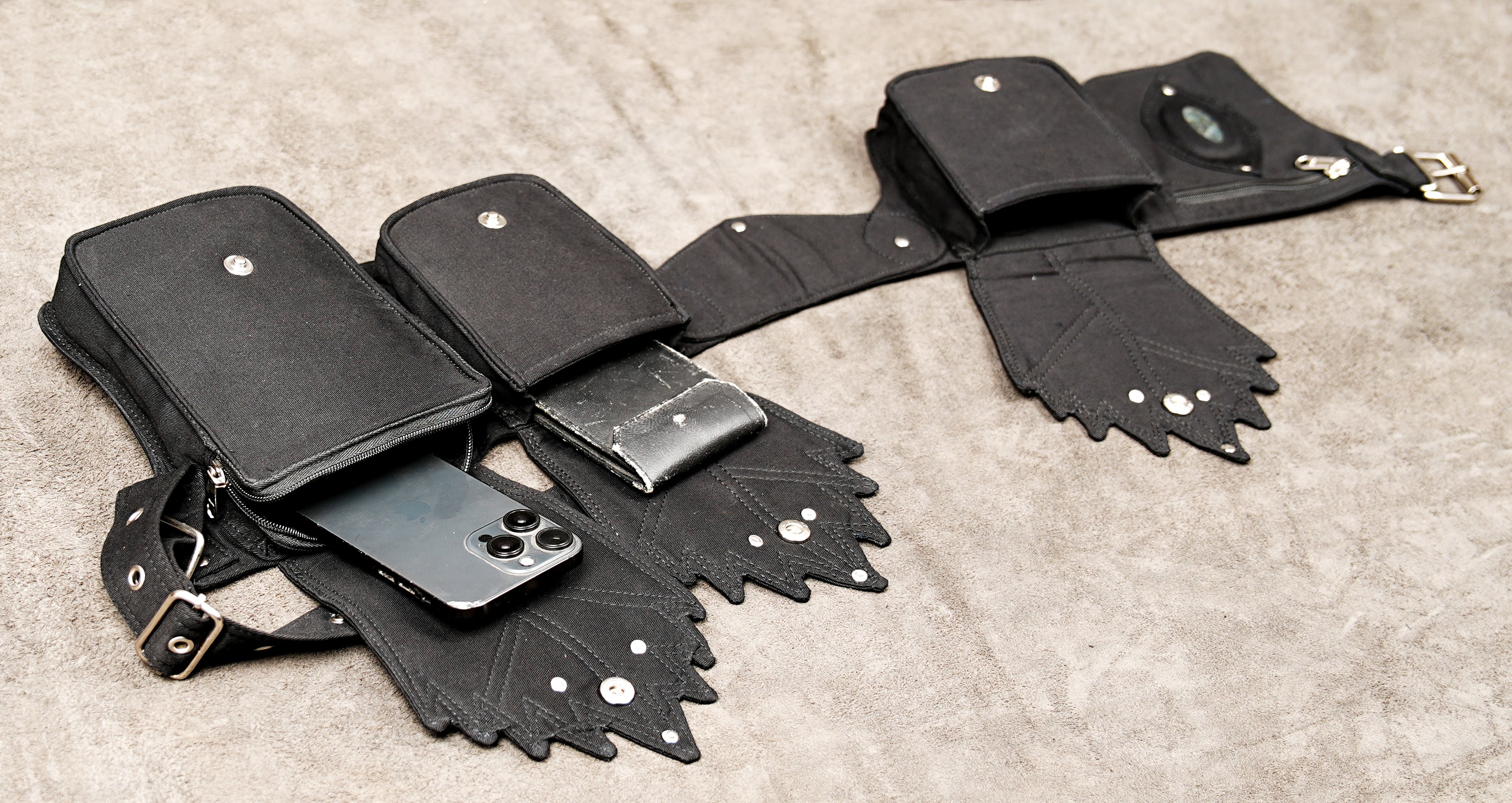 Hands-free travel organizer belt in black canvas with secure pockets for essentials.