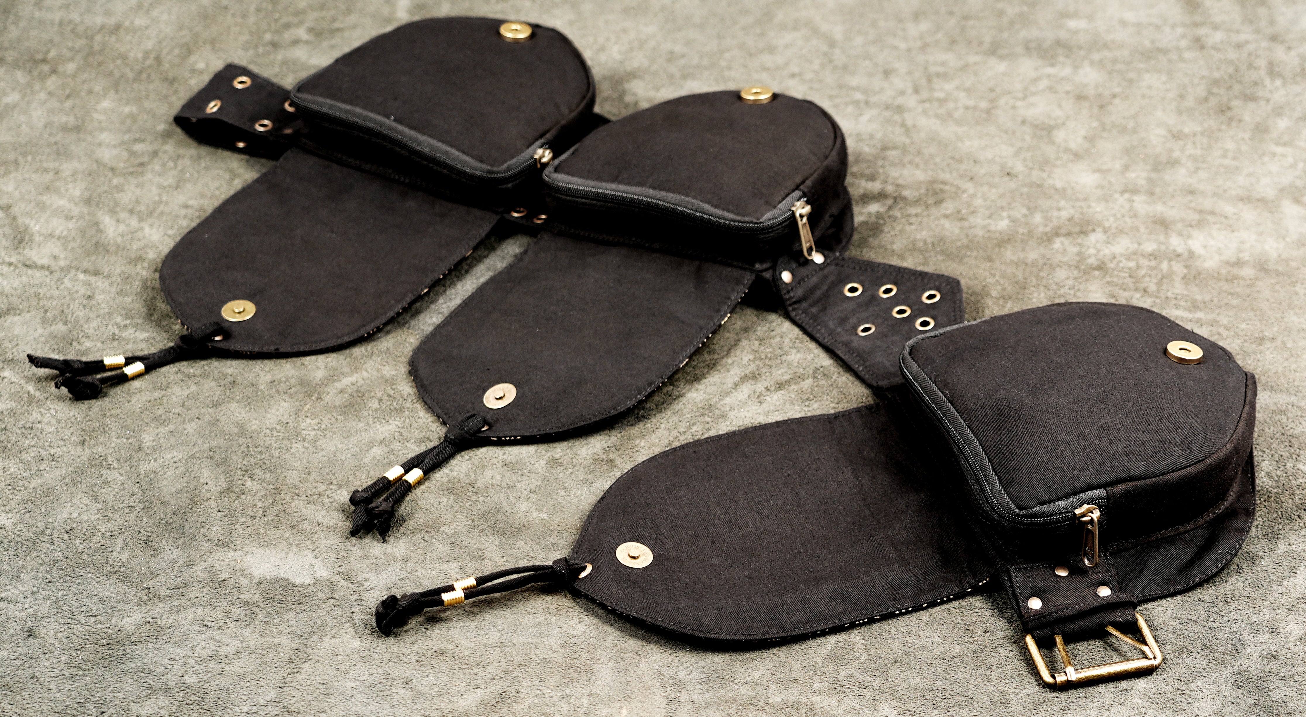 Wide angle view of three pocket festival belt with adjustable strap