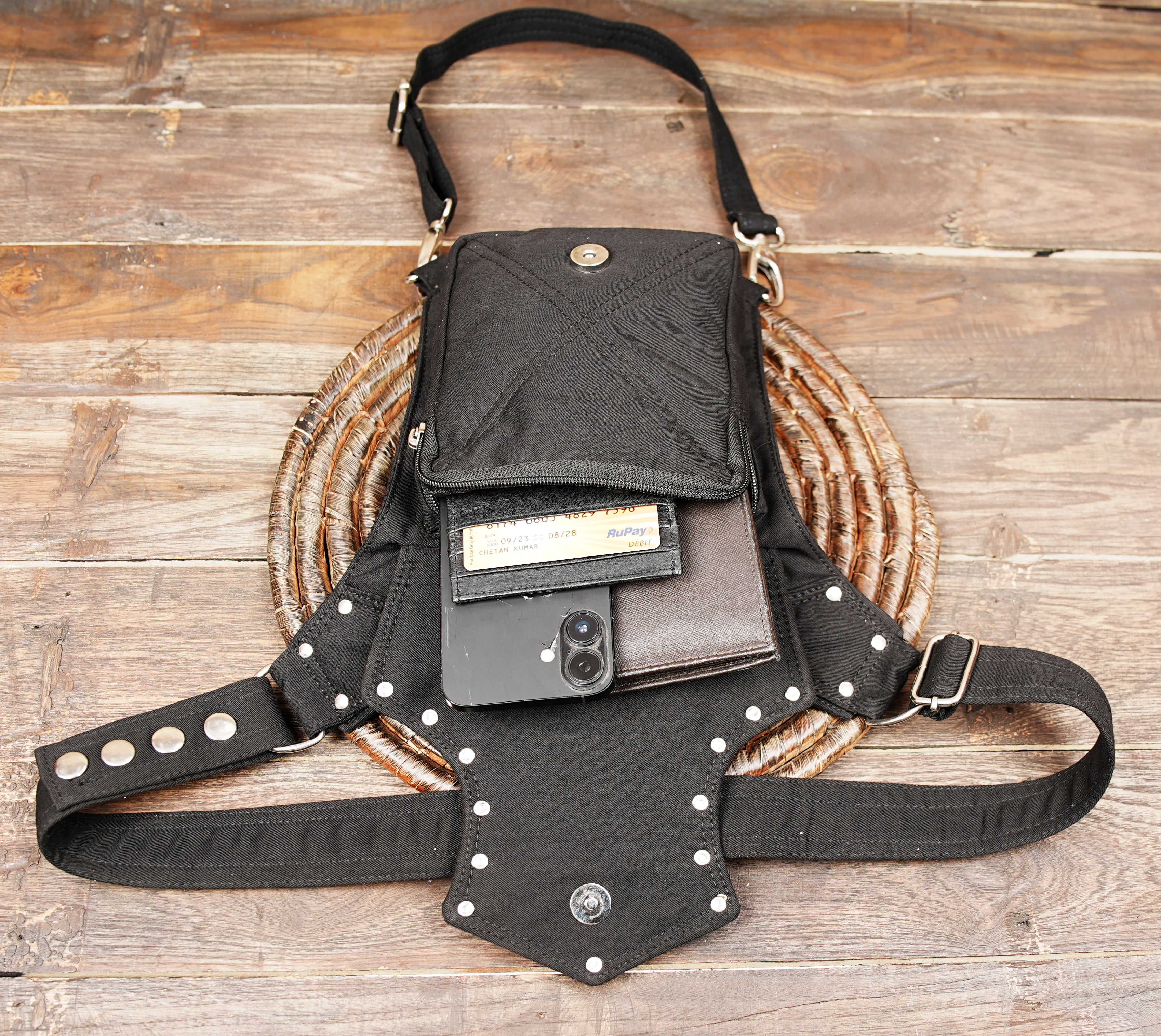 Versatile black canvas leg pouch equipped with zipper pockets and heart detail