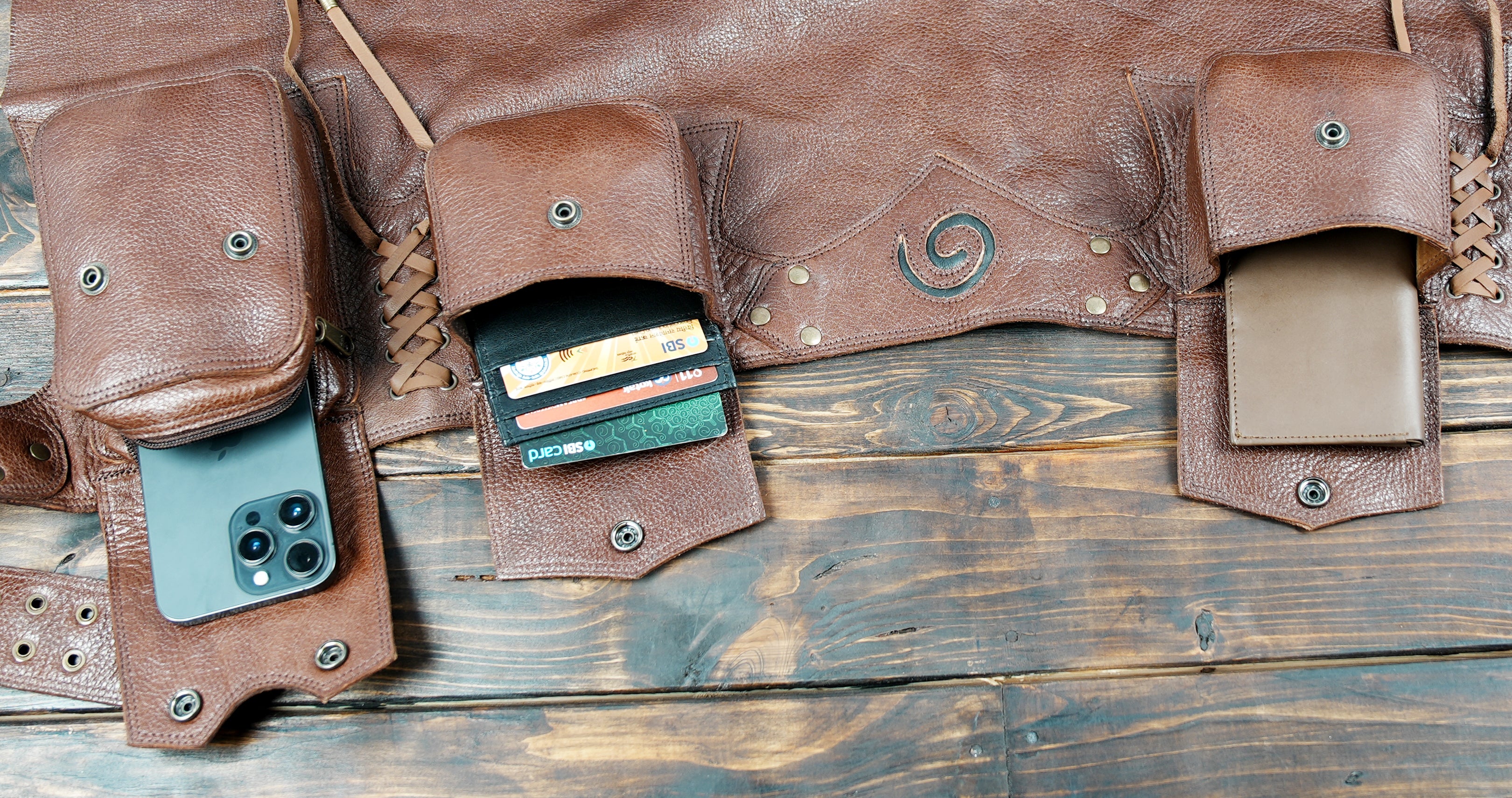 Gothic and tribal style leather skirt with artisan stitching and brass hardware details.