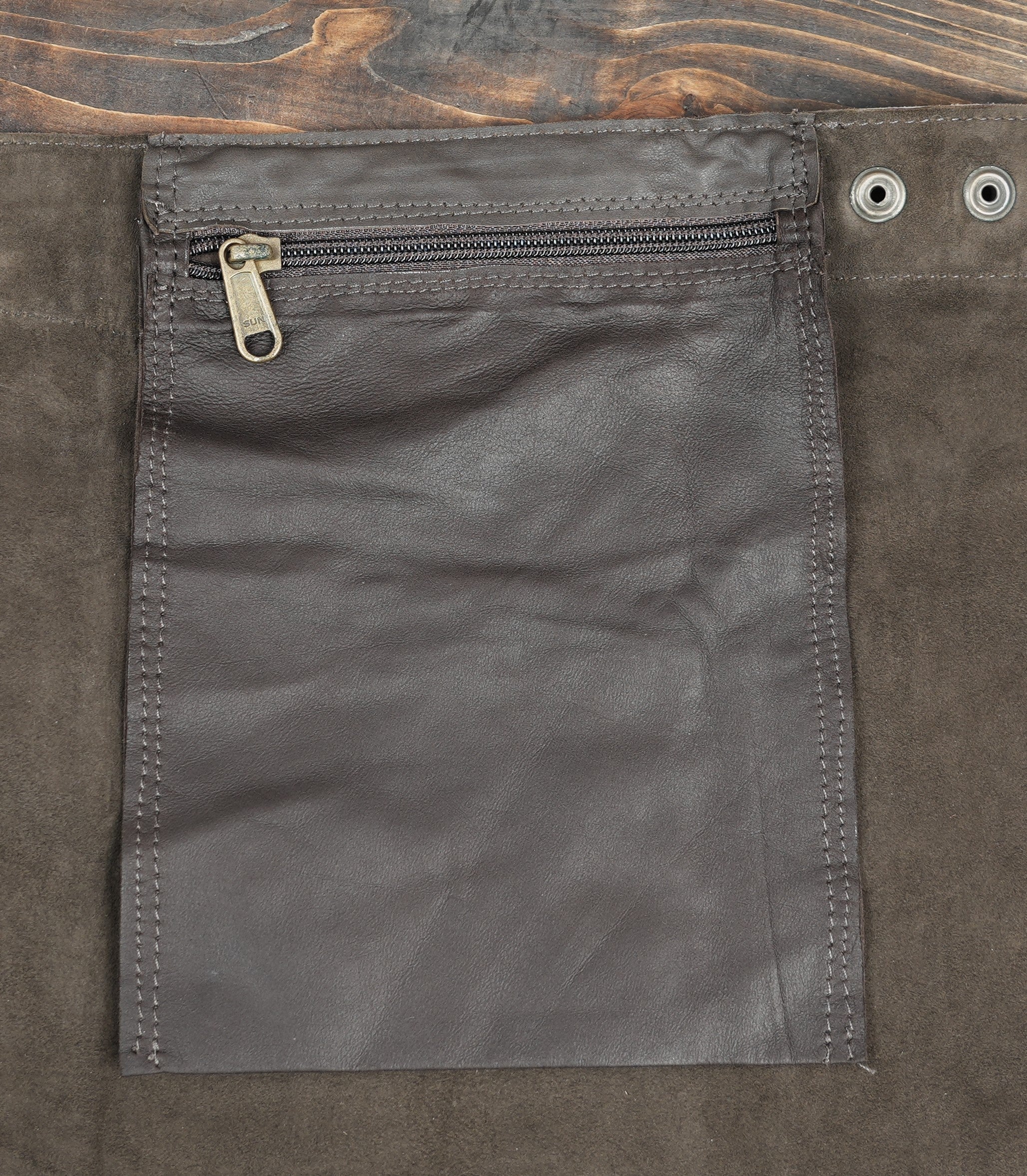 Designer leather skirt with engraved leaf motif