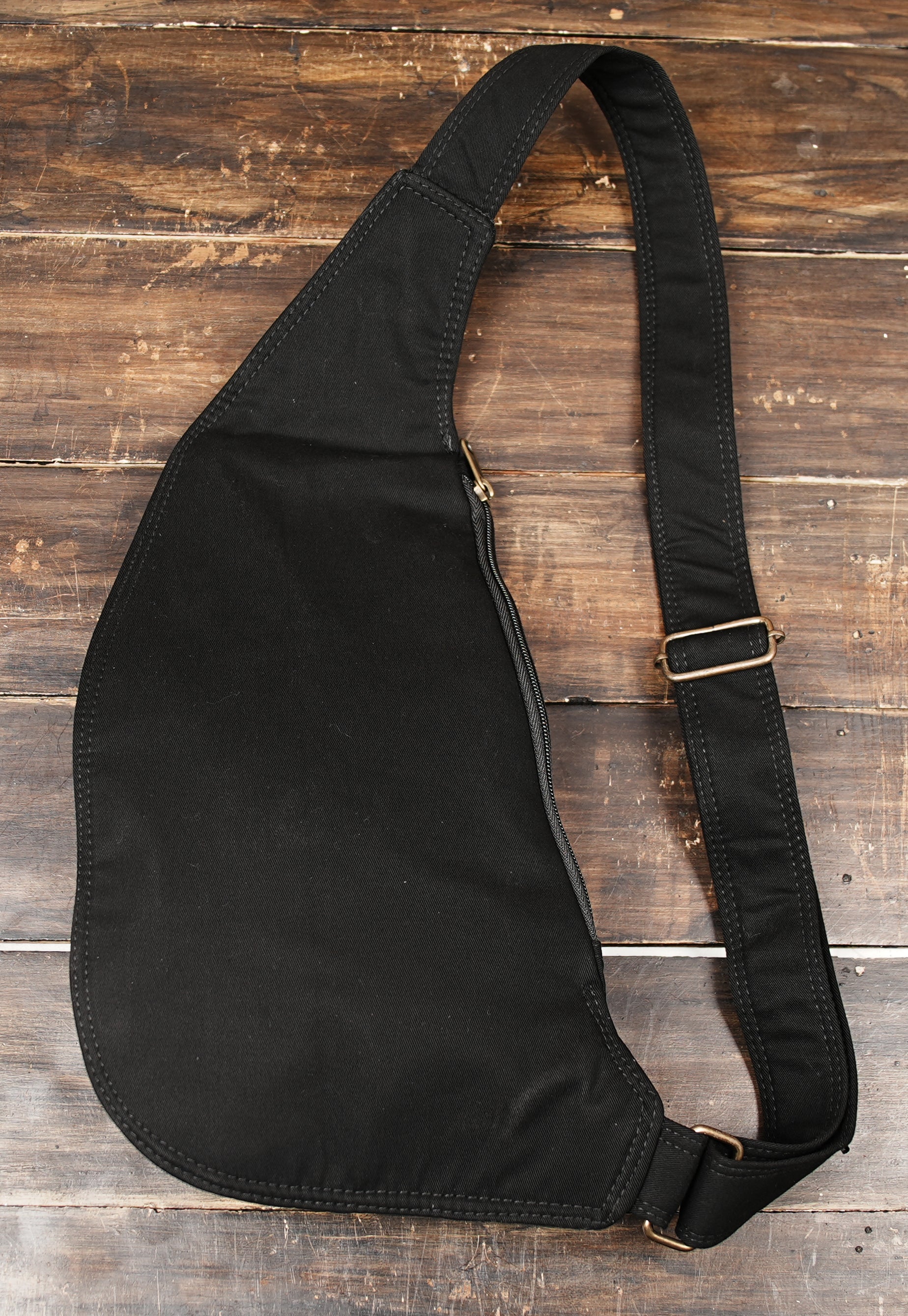 Dark wear aesthetic single-strap crossbody pouch crafted by artisan methods