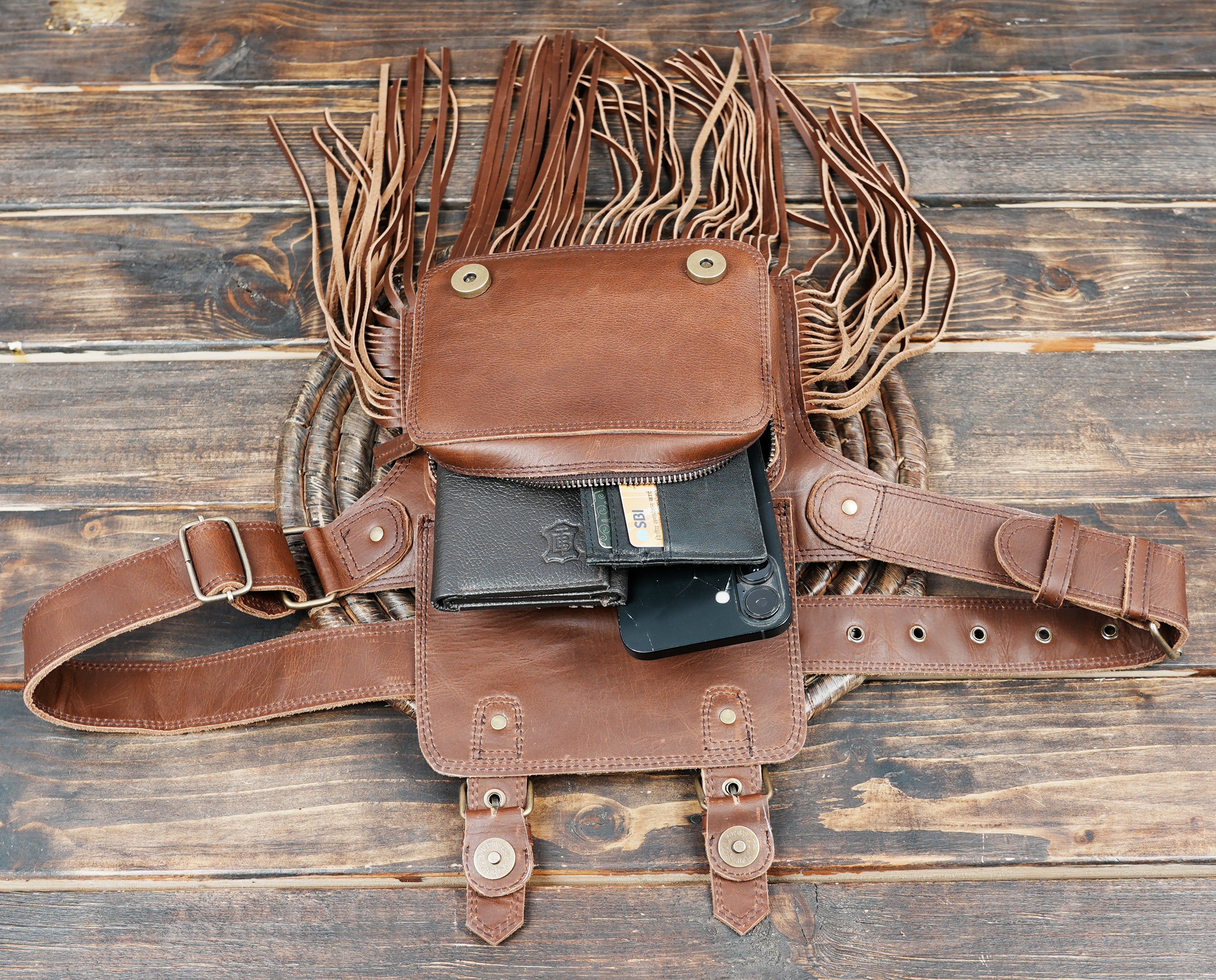 Brown leather hip bag with long tassel fringe