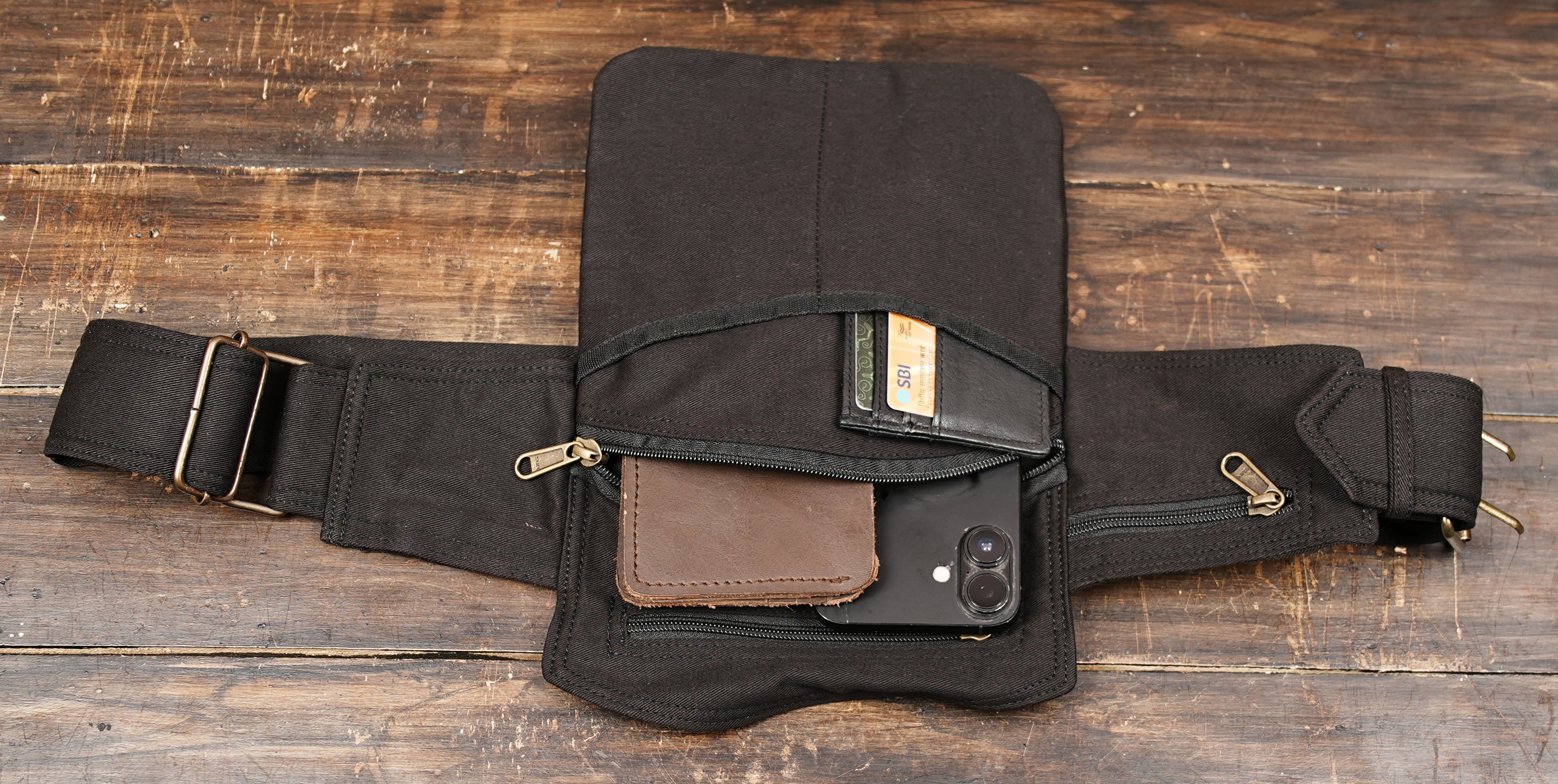 Black canvas waist bag for men and women with practical storage