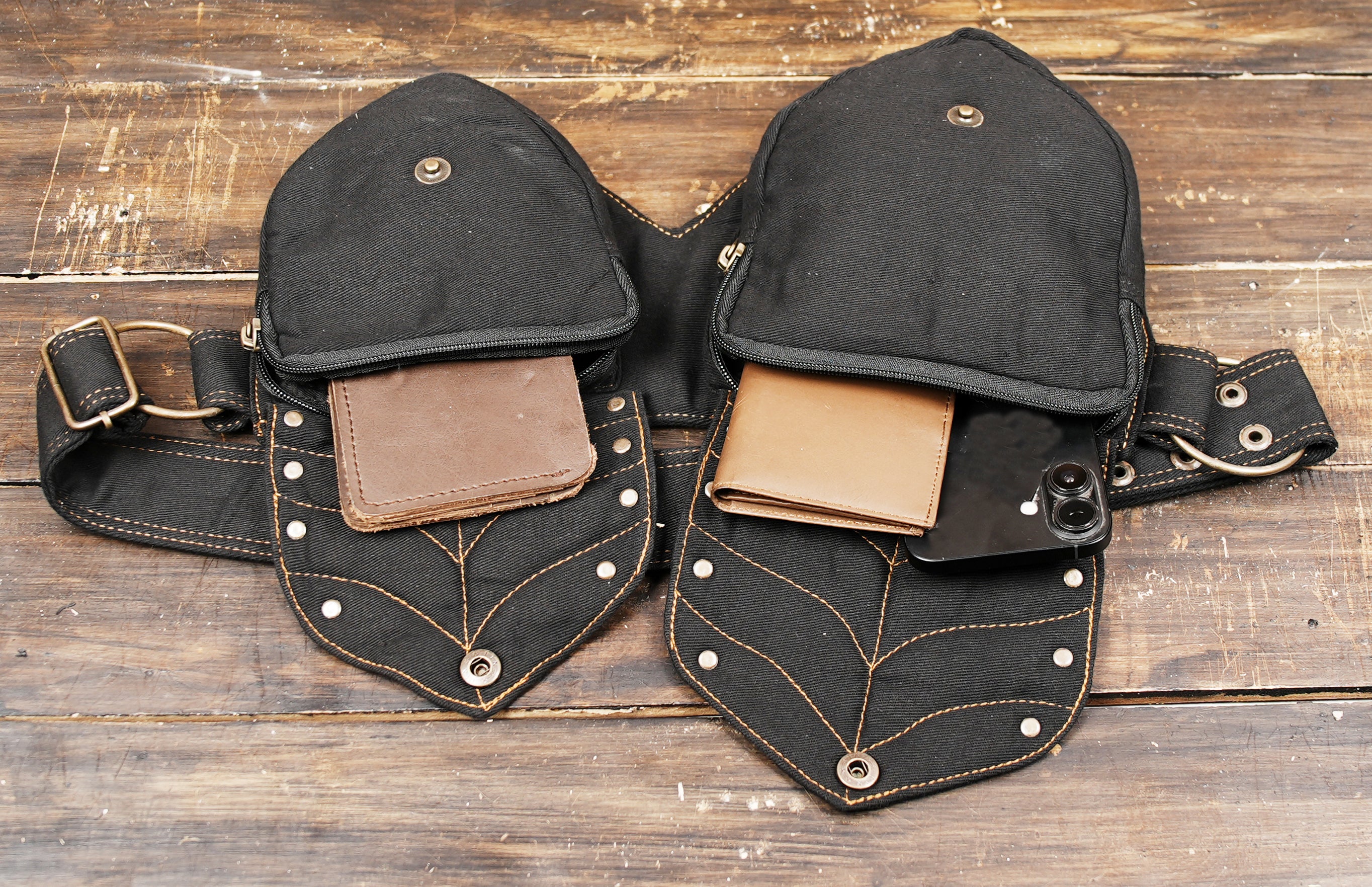 Close-up of steampunk-inspired waist bag with brass rivets and detailed stitching
