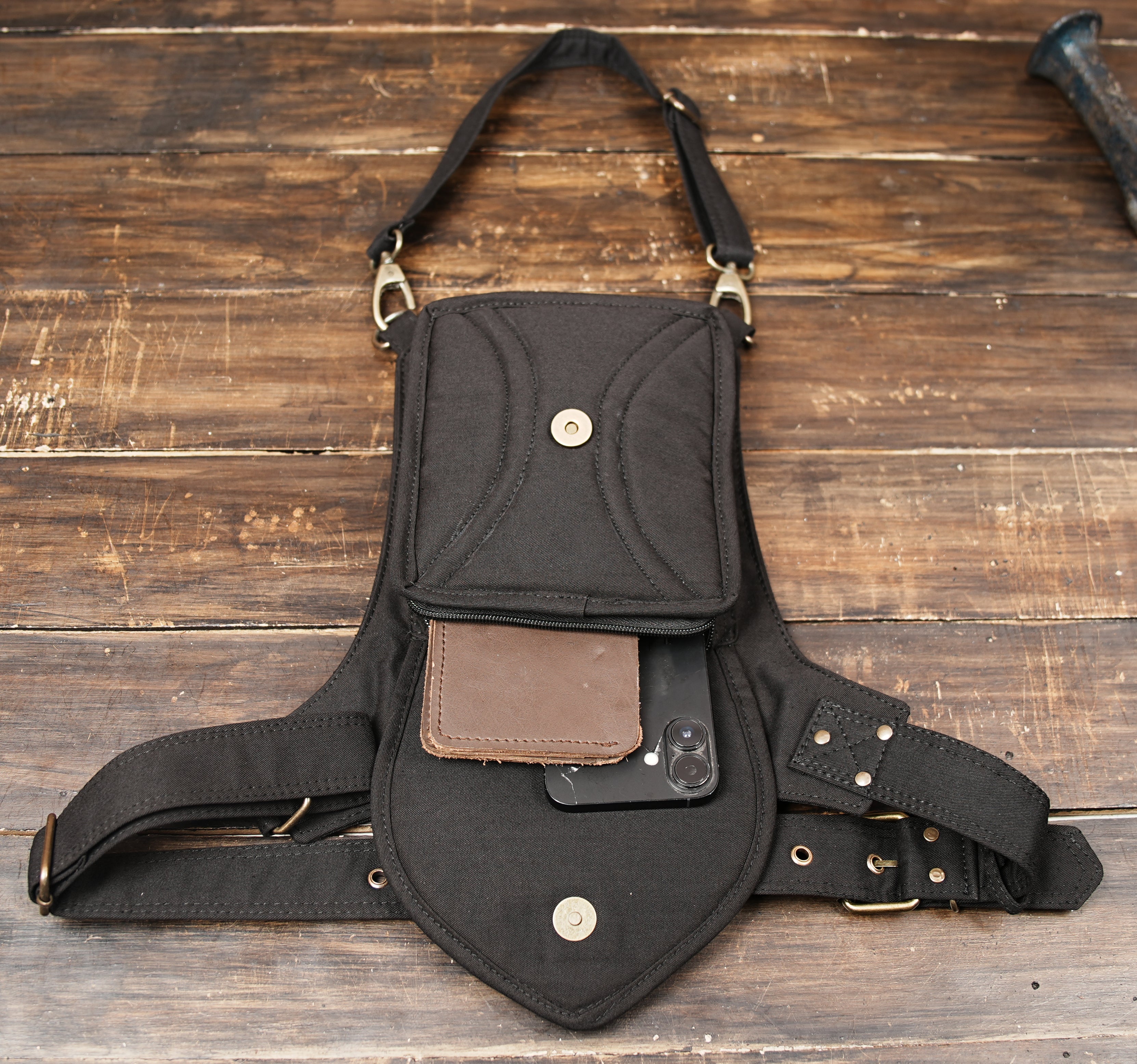 Biker style cotton thigh bag with top zipper pocket and pointed lace front flap.