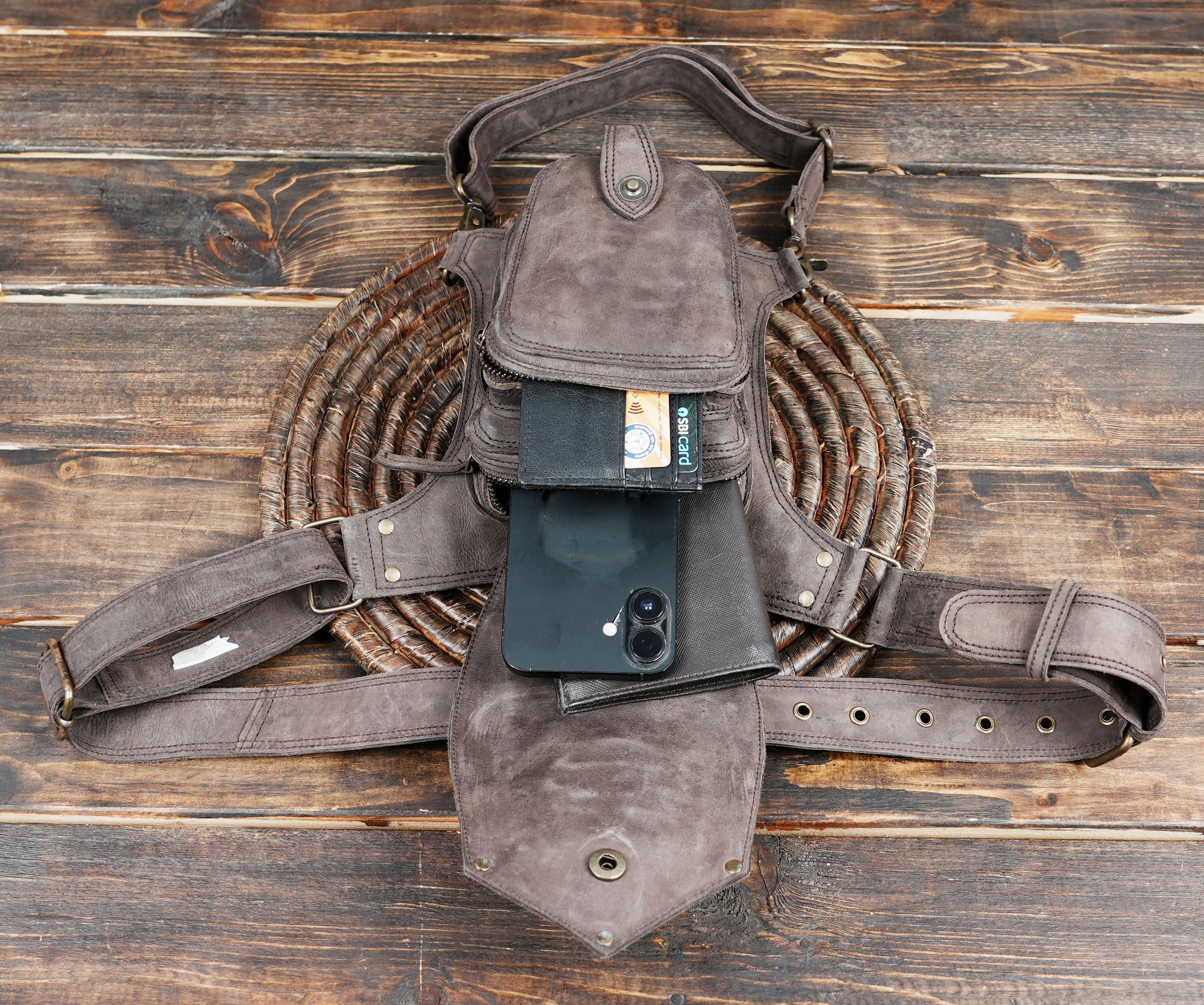 The standout feature of this belt is its intricate stitched panel design, enhanced with rivet detailing for a rustic yet edgy look.